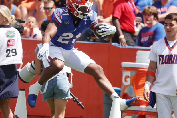 Florida running back Evan Pryor leaps during the 2026 Orange & Blue Game April 11 at Ben Hill Griffin Stadium on the UF campus in Gainesville. (Stephen M. Dowell/Orlando Sentinel)