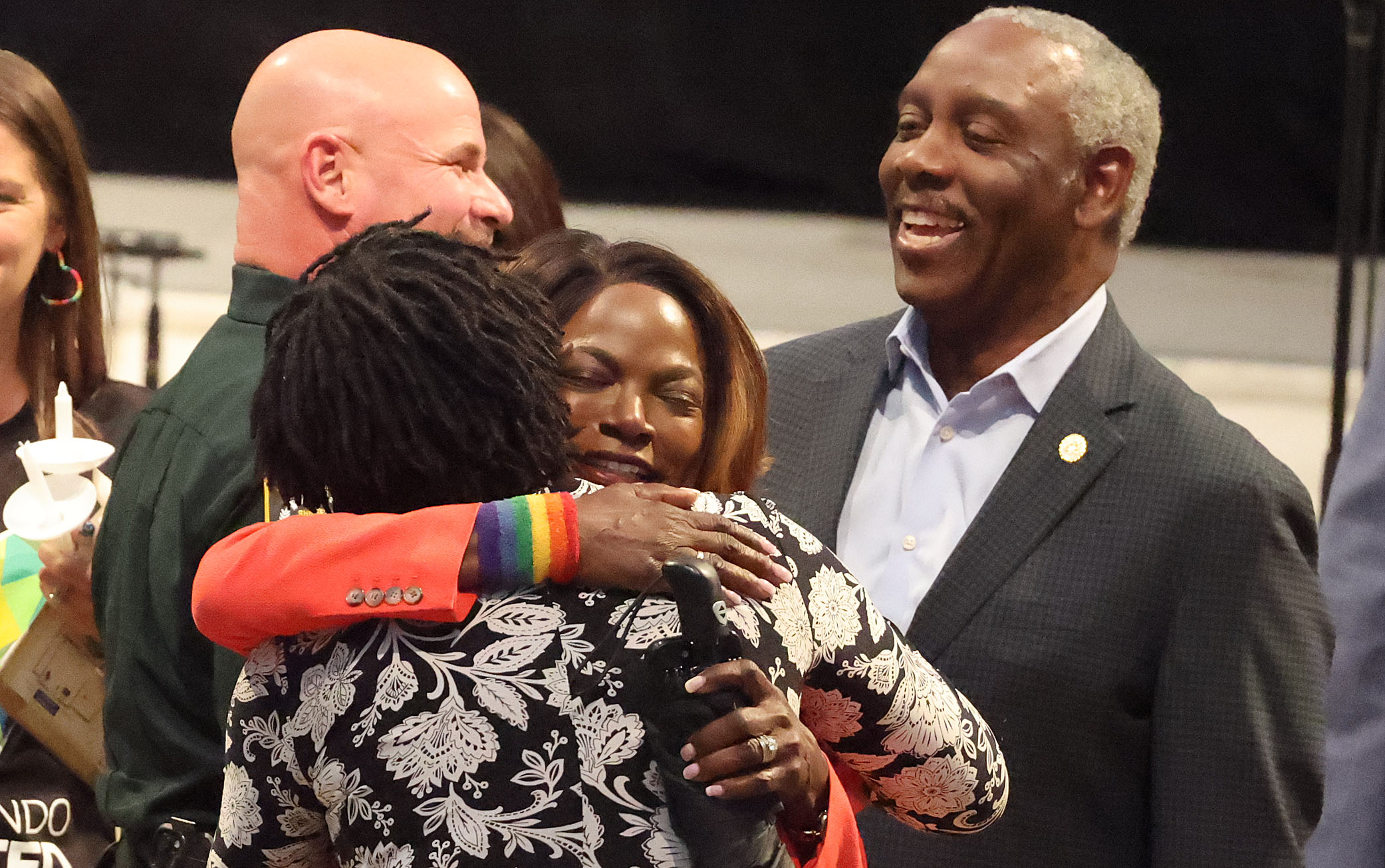 Orange County Mayor Jerry Demings (right) watches his wife, Former...