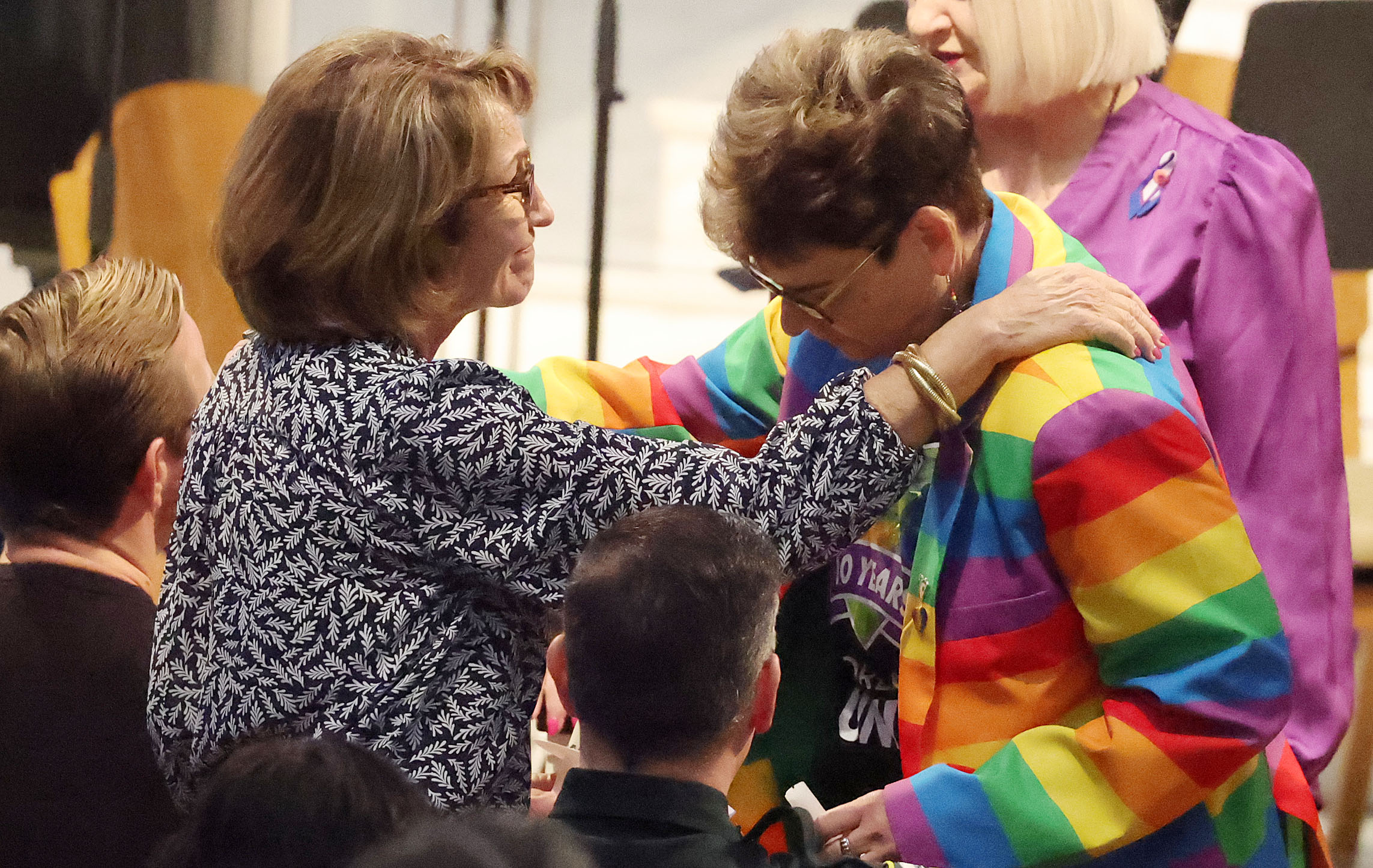Orange County School Board Chair Teresa Jacobs (left) shares a...