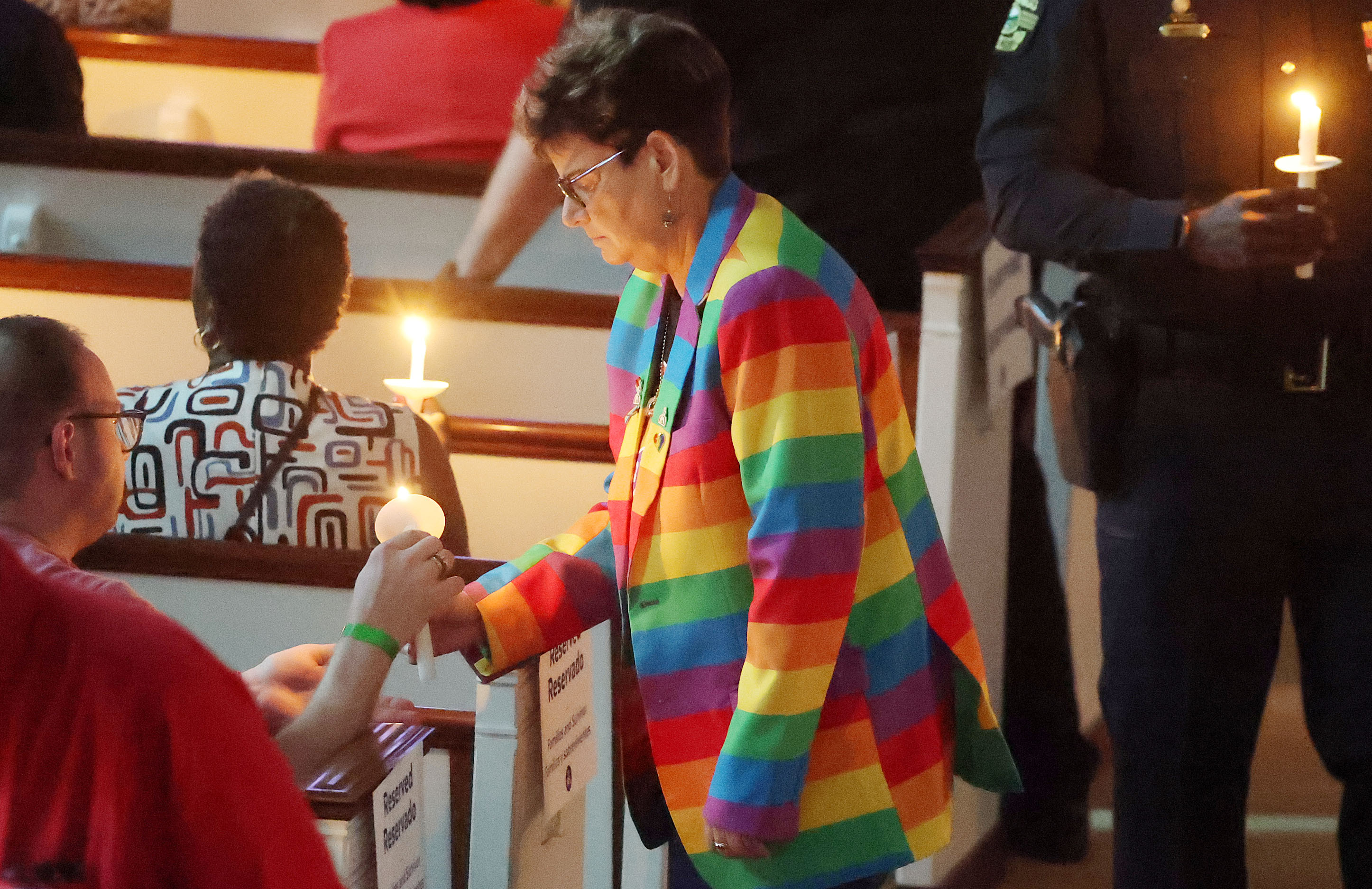 Orlando City Commissioner Patty Sheehan lights candles during the 2026...