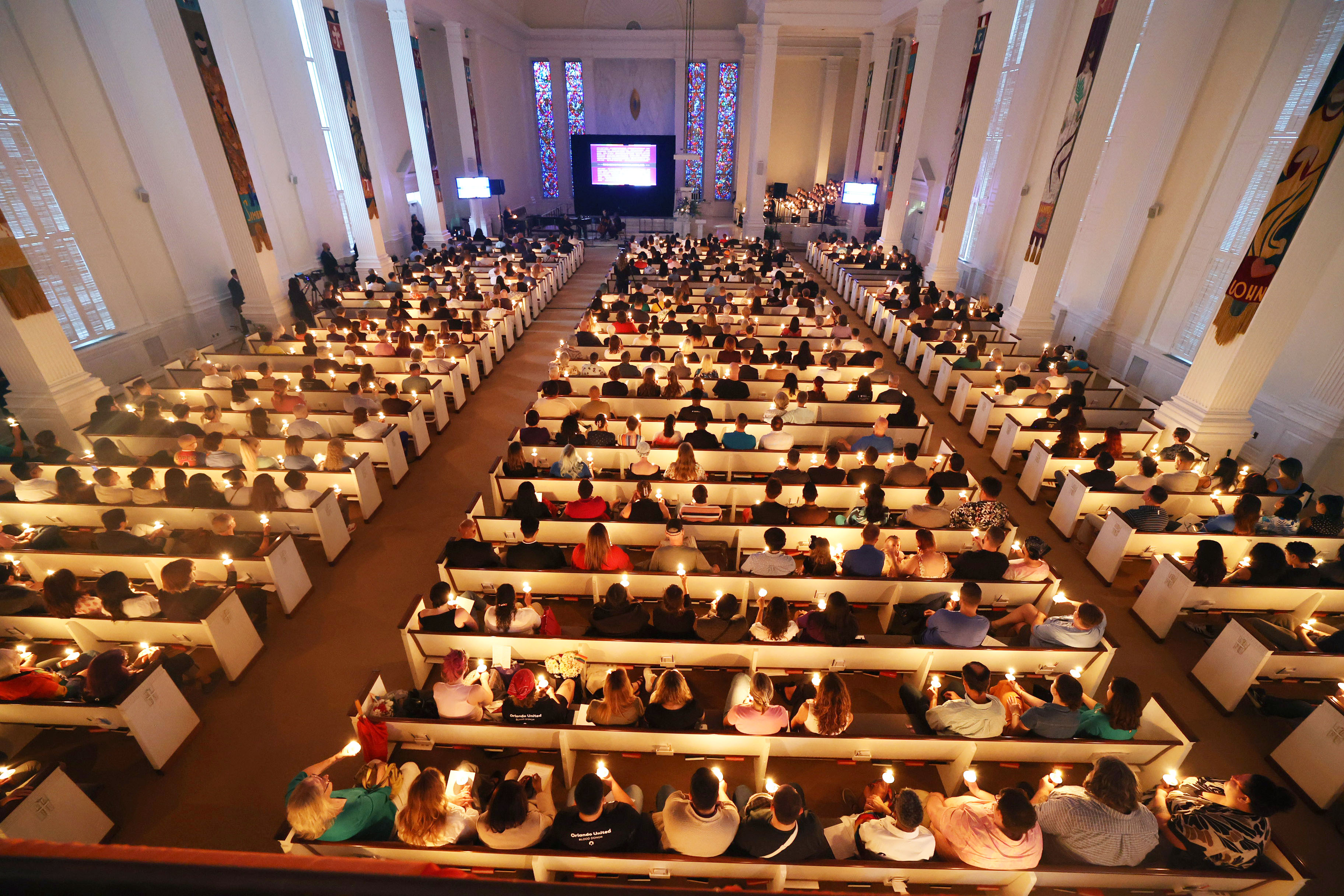 Candles are lit during the 2026 Pulse Day of Remembrance...