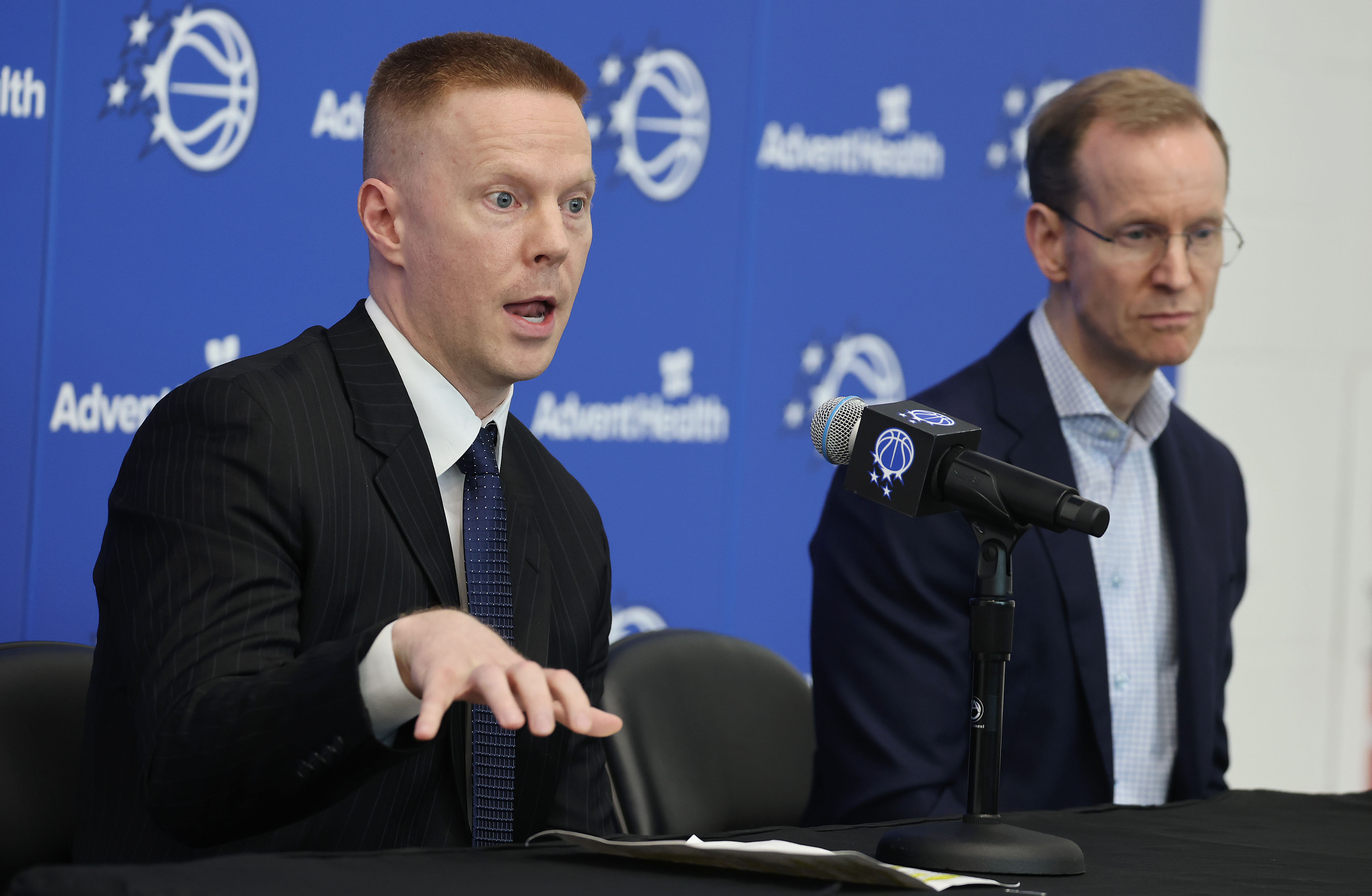 New Orlando Magic head coach Sean Sweeney, left, gestures beside...