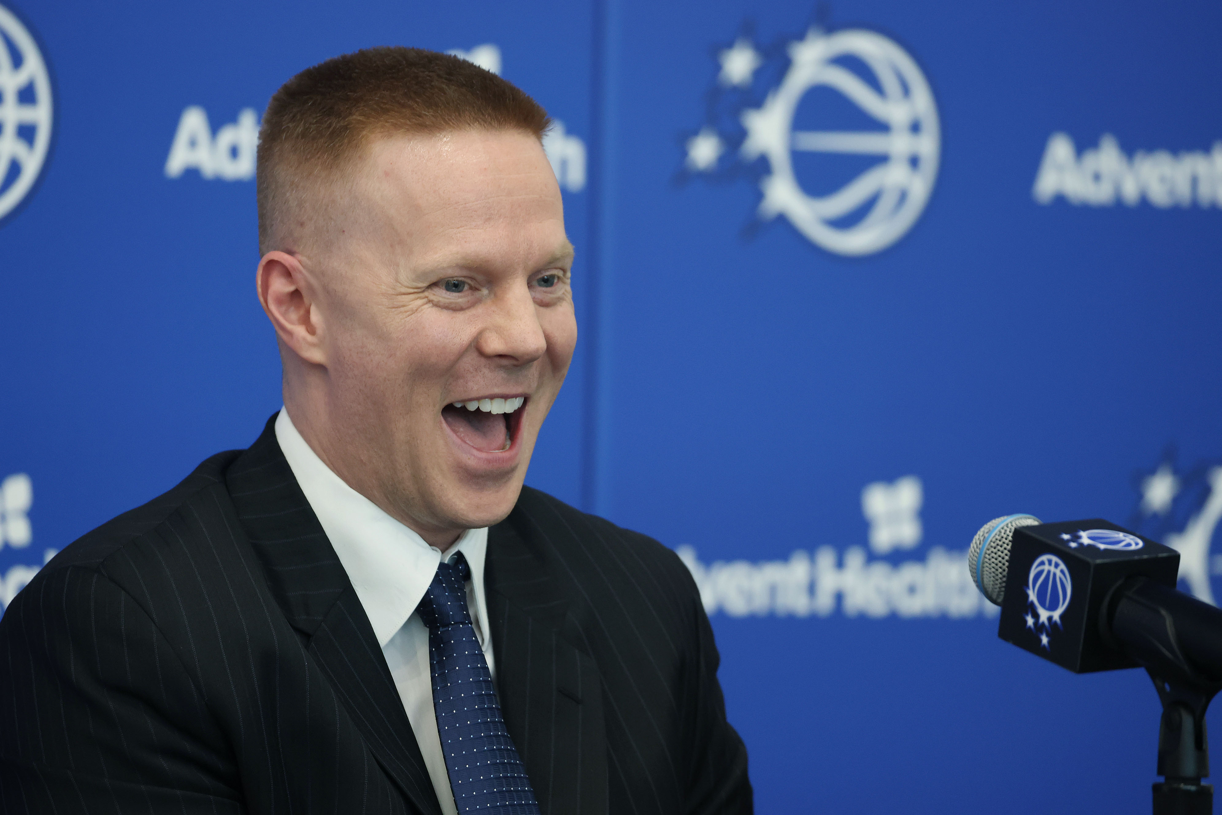 New Orlando Magic head coach Sean Sweeney laughs during a...