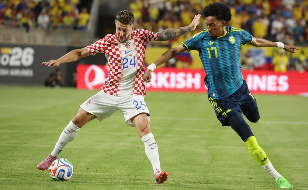 Croatia player Marco Pasalic (24) controls the ball beside Columbia player J. Mojica (17) during the Road to 26 FIFA Match of Colombia versus Croatia at Camping World Stadium in Orlando on Thursday, March 26, 2026. Croatia won the match 2-1. (Stephen M. Dowell/Orlando Sentinel)