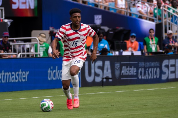 United States defender Alex Freeman (16) dribbles the ball against Senegal in the first half of an international friendly soccer match Sunday, May 31, 2026, in Charlotte, N.C. (AP Photo/Scott Kinser)