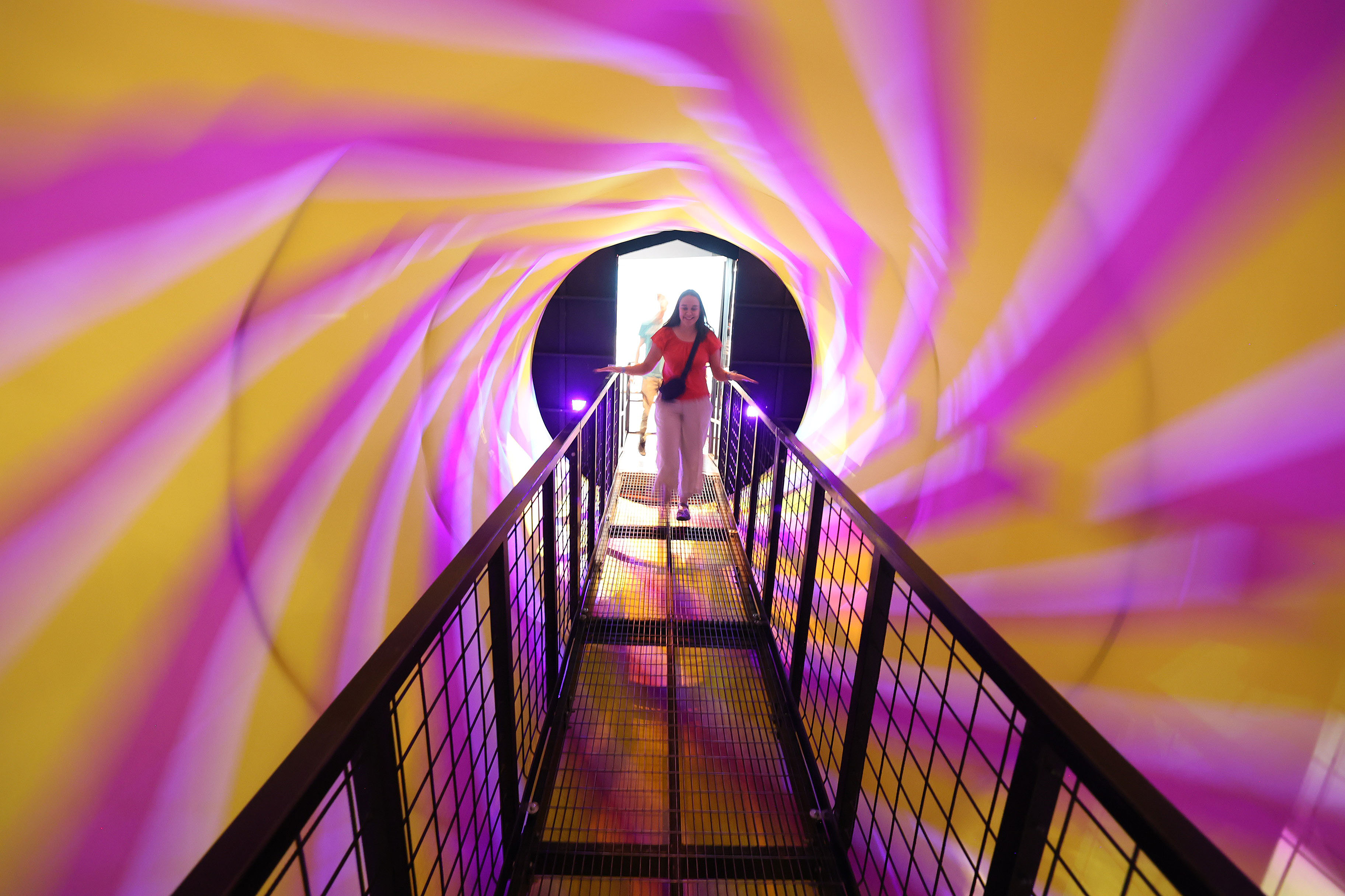 A guest enters a spinning display during Orlando Science Centerâs...