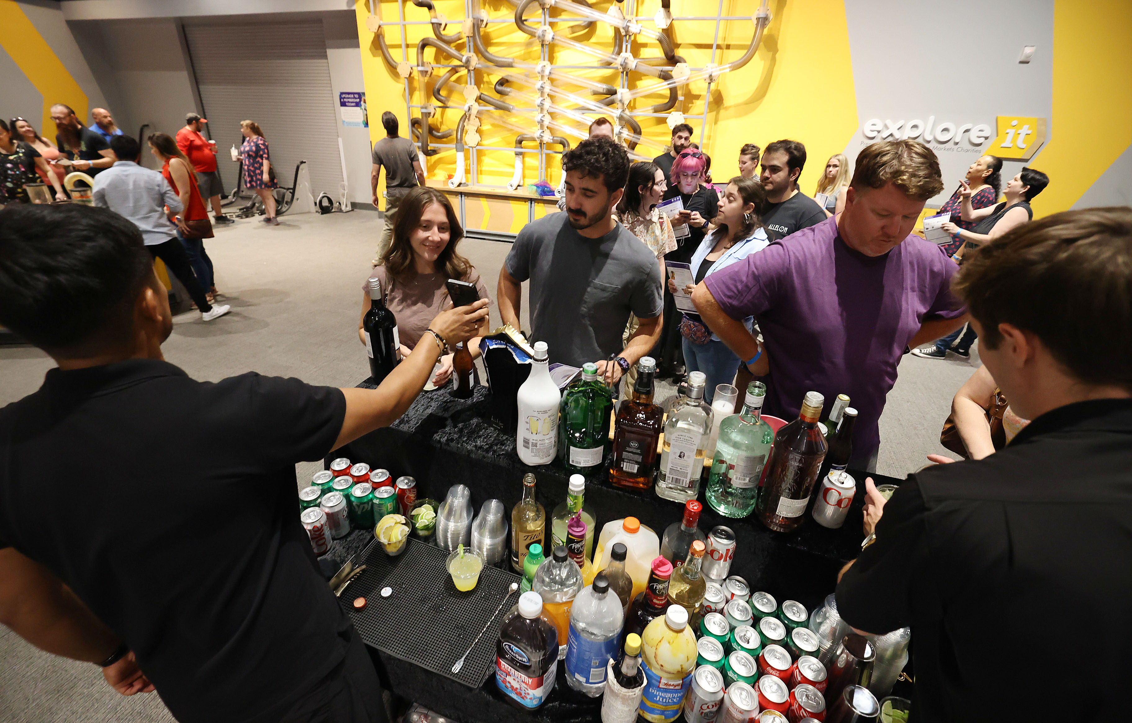 Guests are lined up at a bar during Orlando Science...