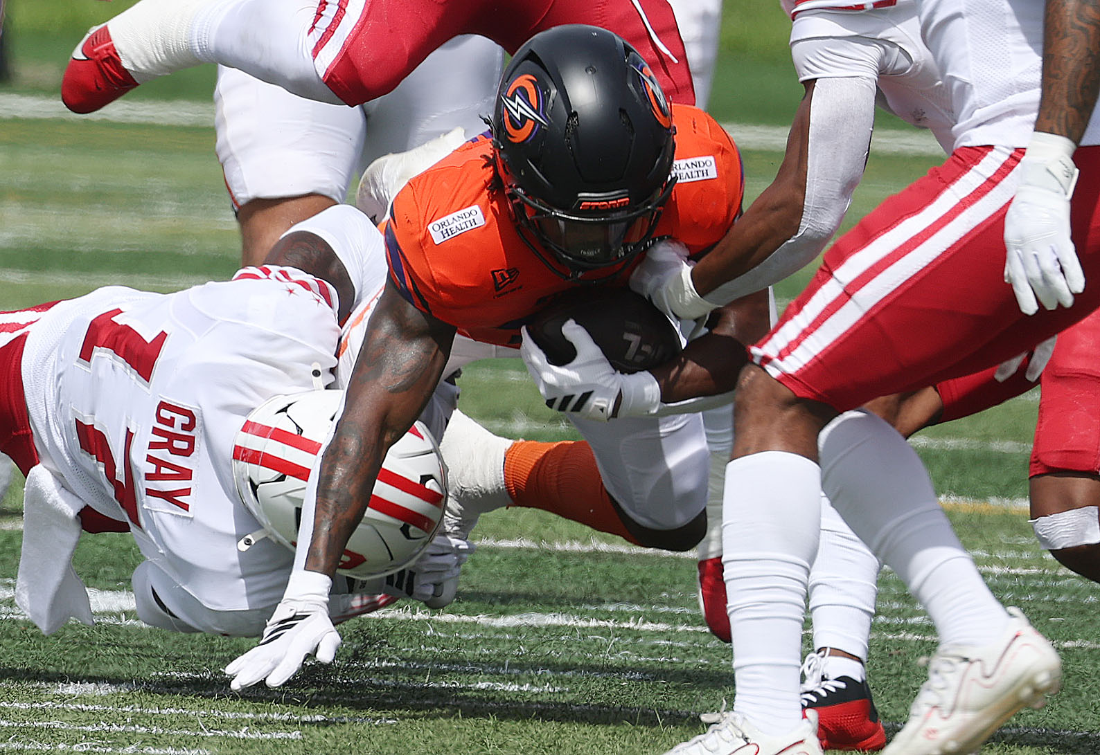 Storm running back Elijah Dotson leaps for extra yardage during...
