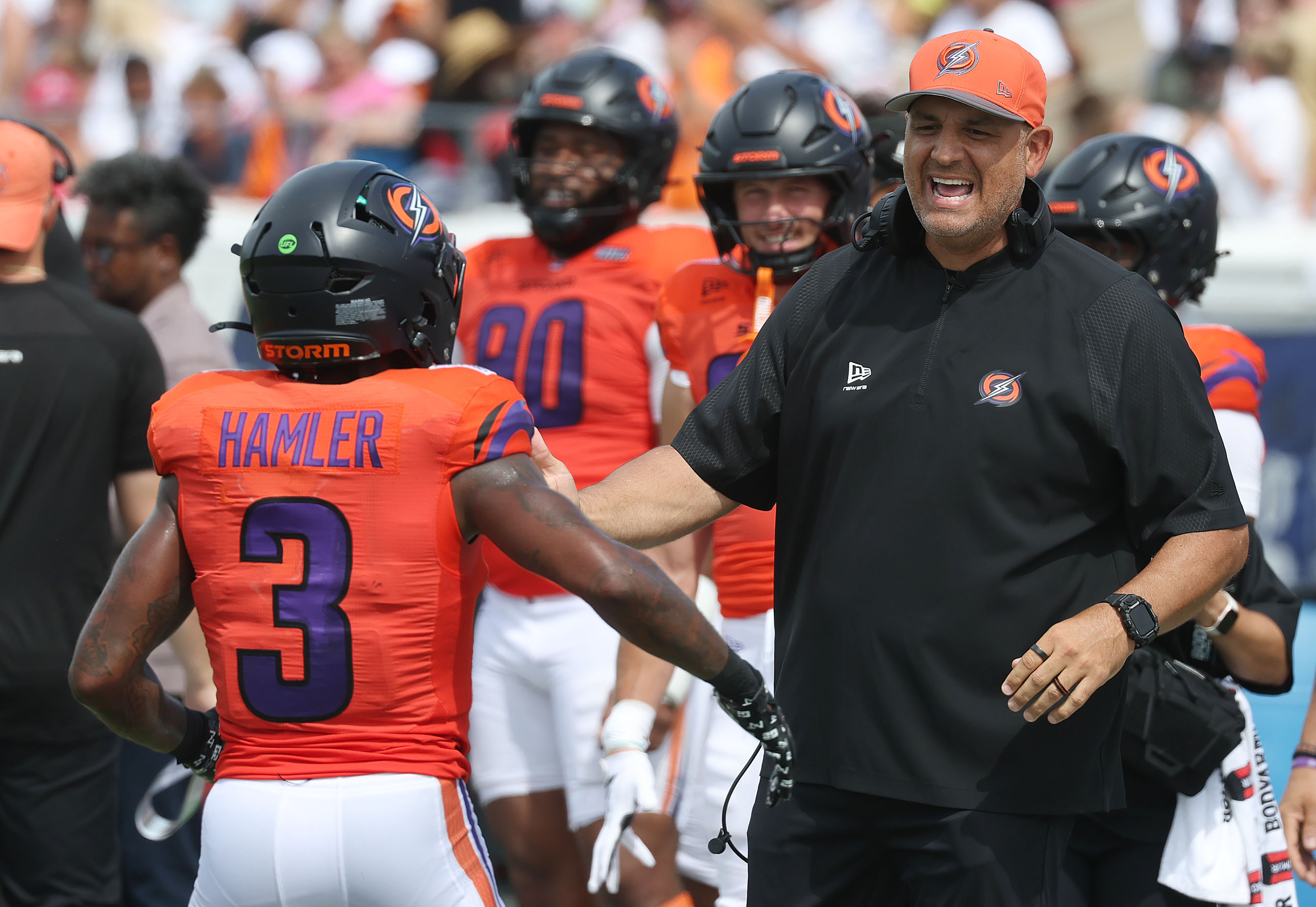 Storm head coach Anthony Becht congratulates wide receiver K.J. Hamler...