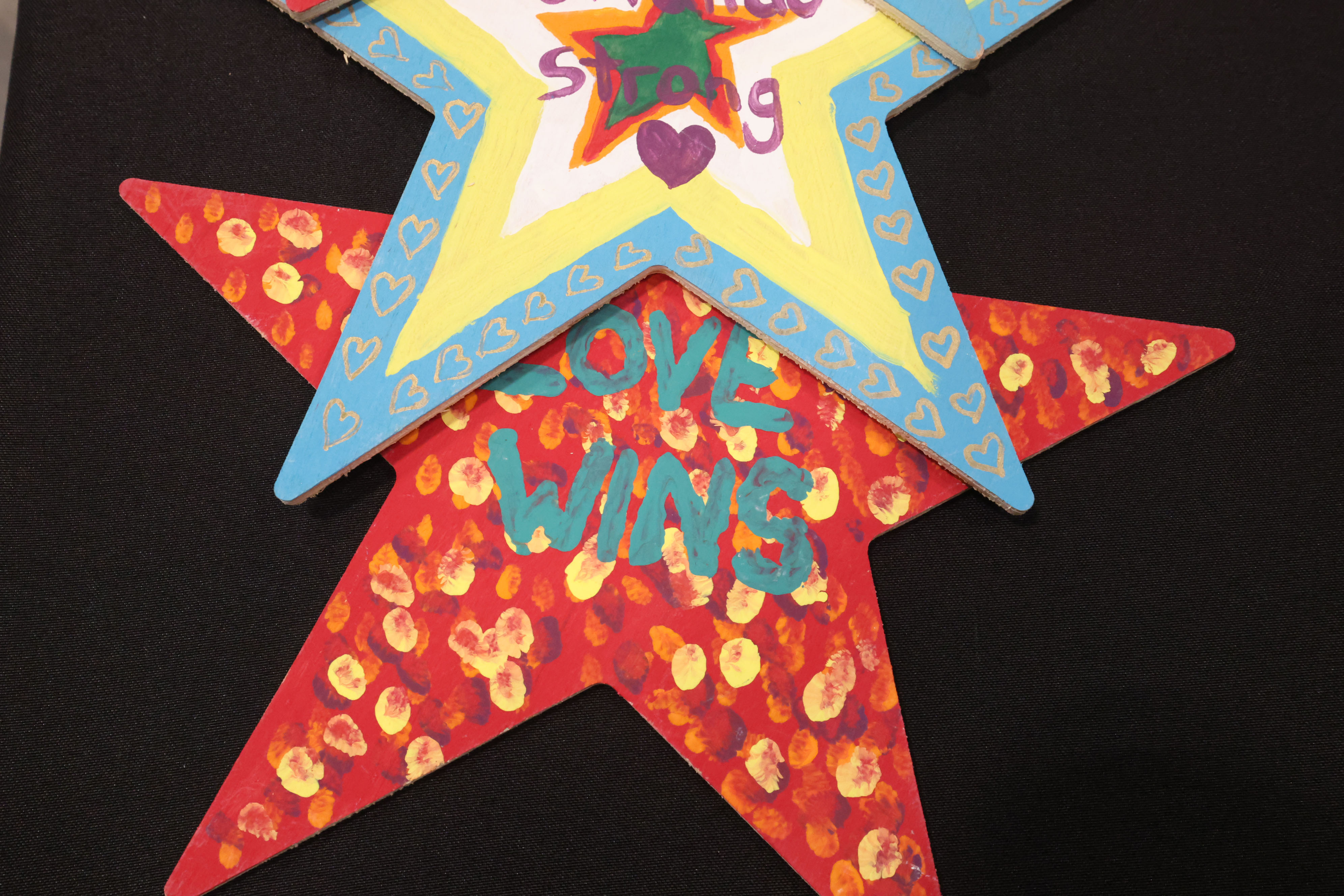 Painted star decorations with messages are among artifacts and items...