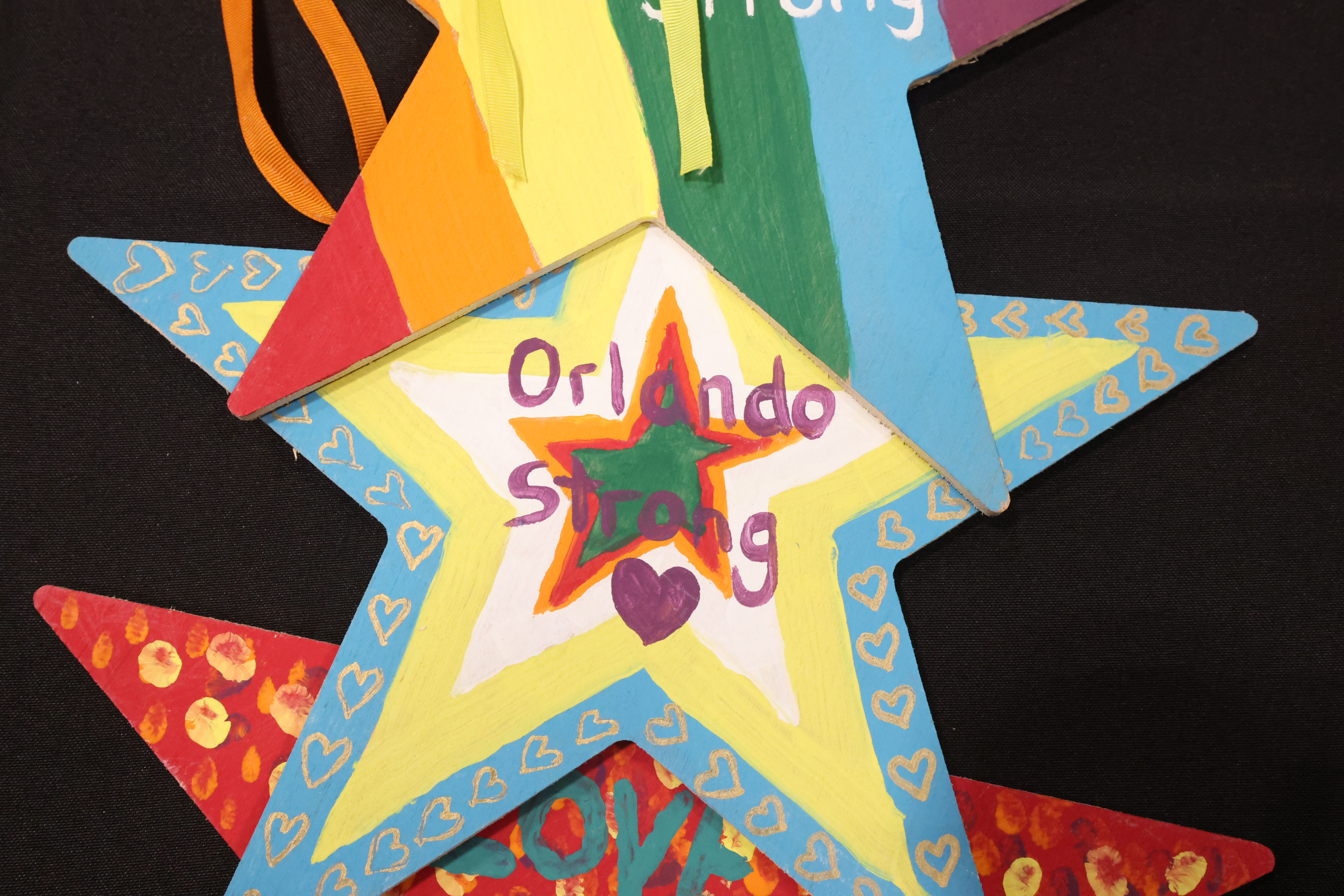 Painted star decorations with messages are among artifacts and items...