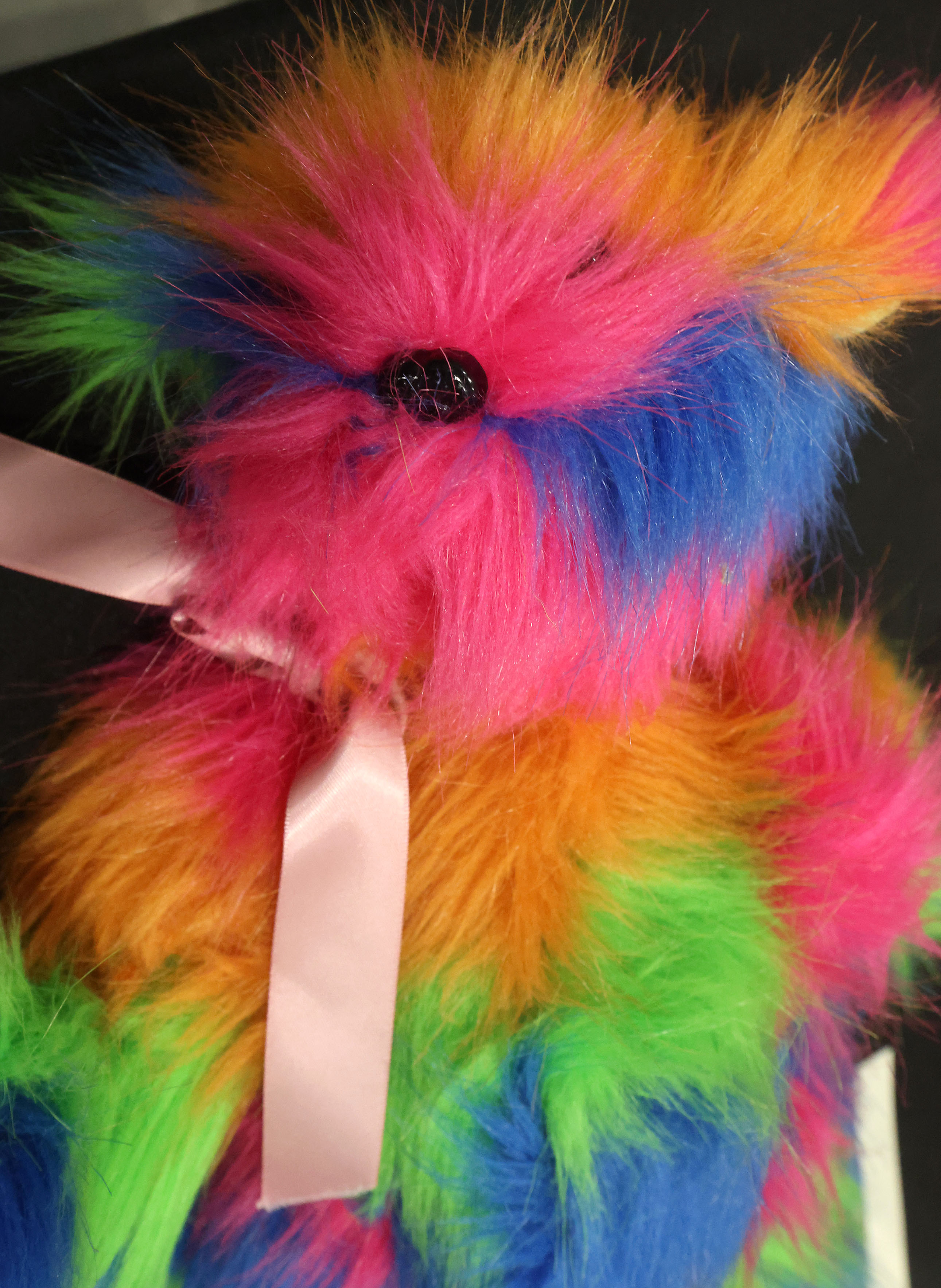 A colorful teddy bear is among artifacts and items collected...