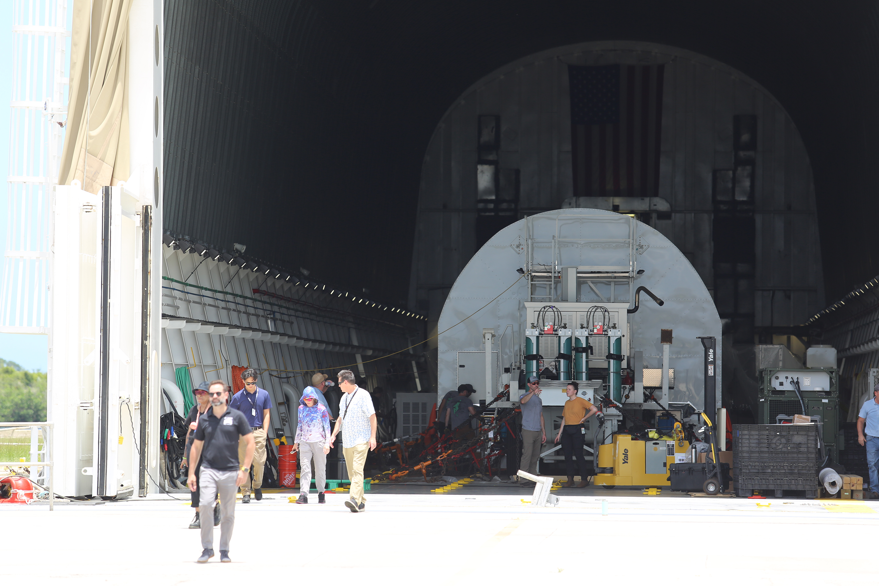 Lucas Paganini, program executive in NASAâs Astrophysics Division, walks out...
