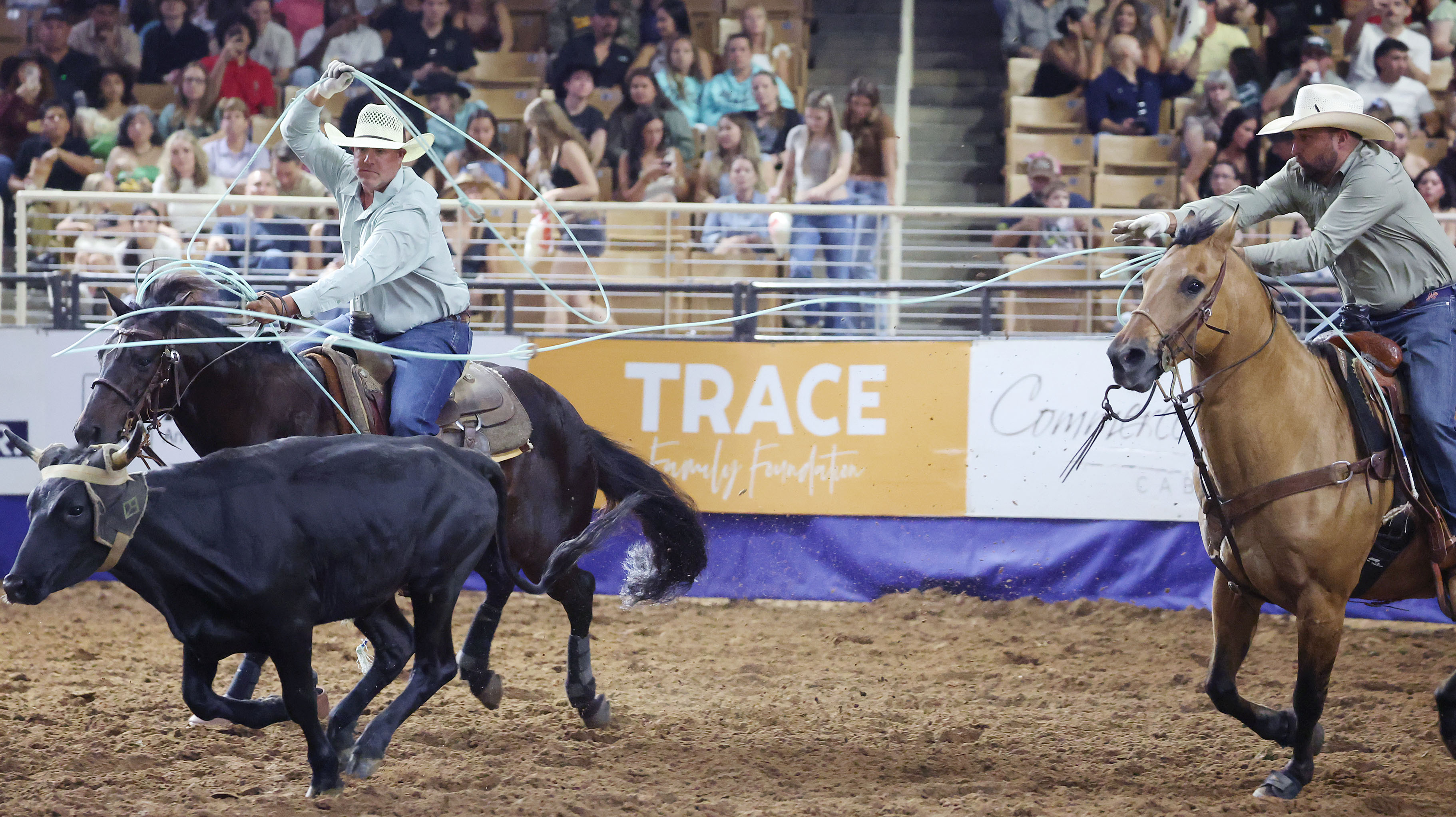 Clint Keller and Morgan Jones swing the lassos in the...