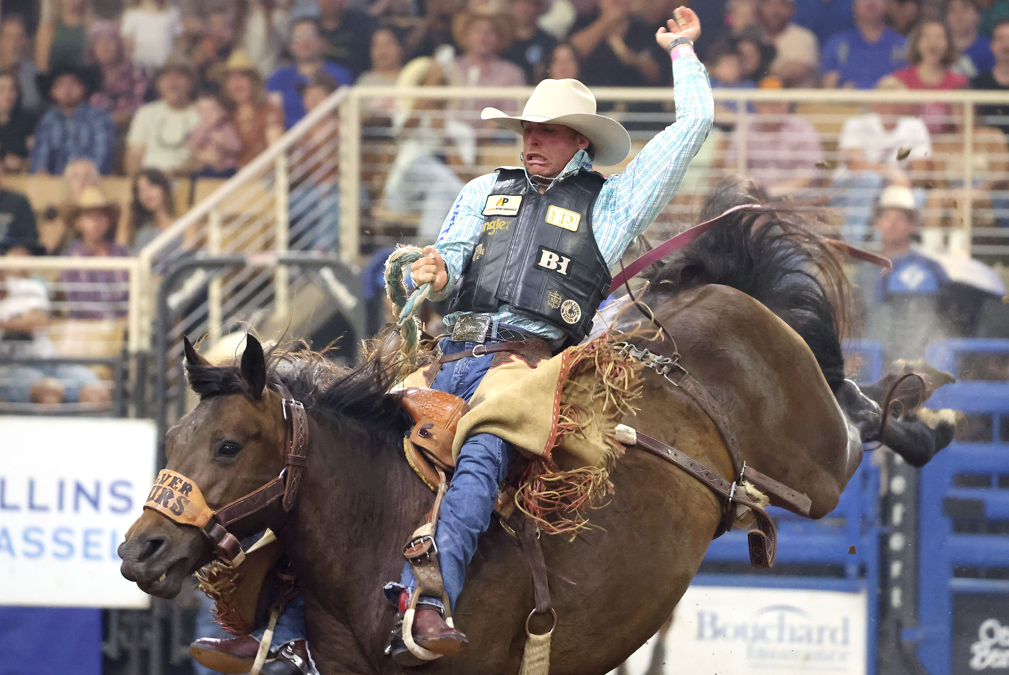 Zac Bourgeois rides a bucking bronc during the Silver Spurs...