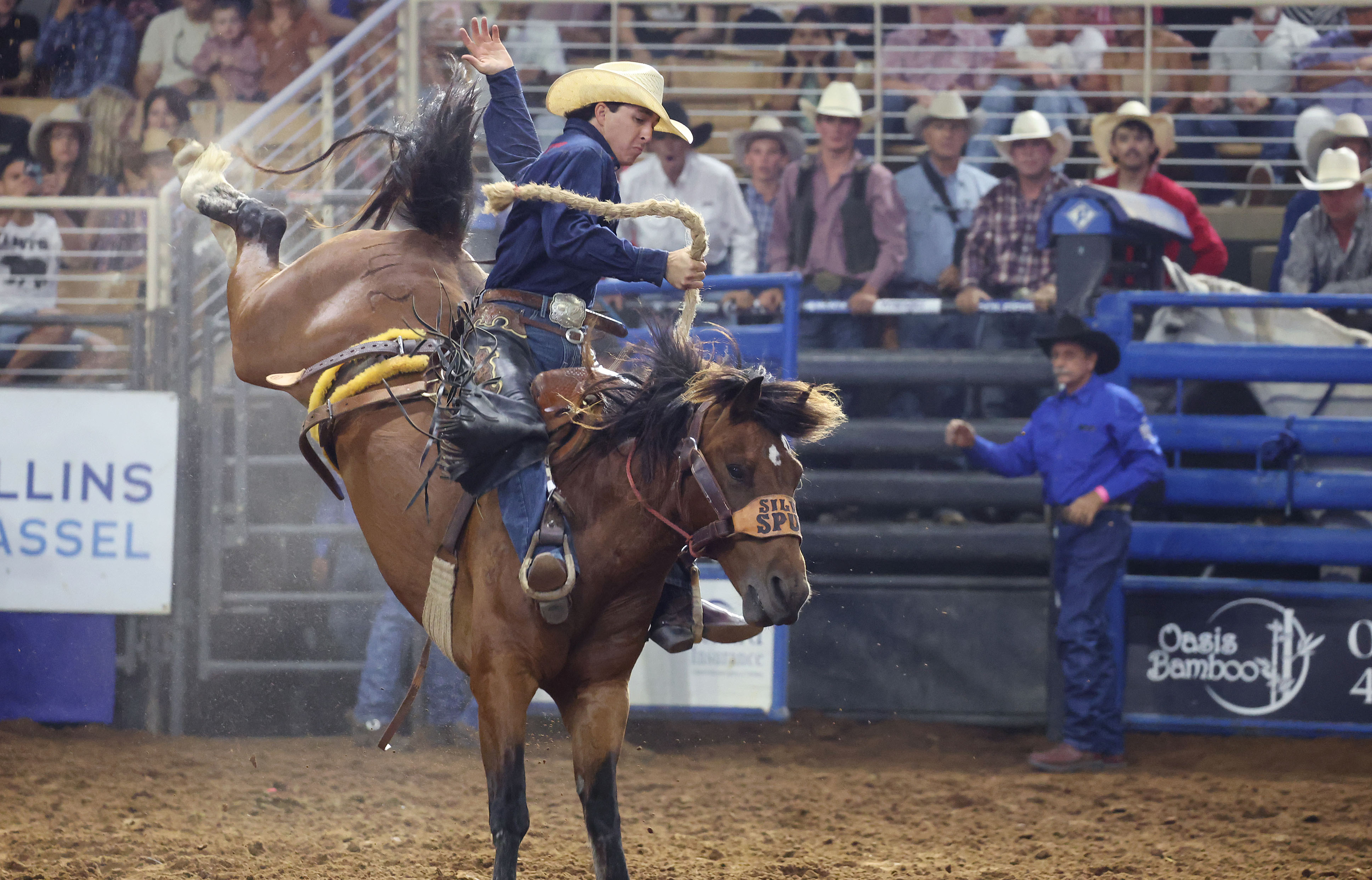 Keene Justesen hangs onto a bucking bronc during the Silver...