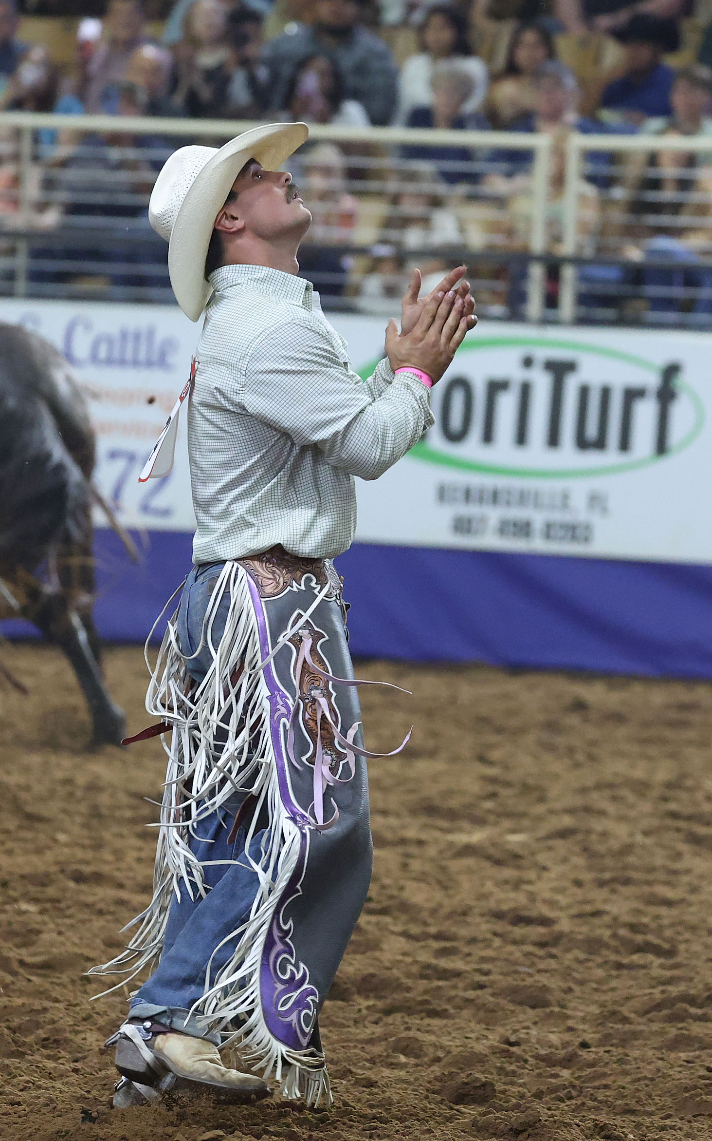 Wyatt Lavergne is pleased with his saddle bronc ride during...