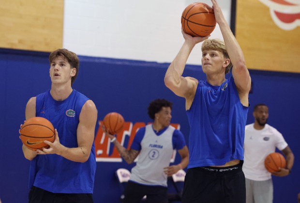 Florida basketball players Alex Condon, left, and Thomas Haugh have formed an enduring friendship and championship bond with the Gators, who welcome back the two seniors for a final run. (Stephen M. Dowell/Orlando Sentinel)