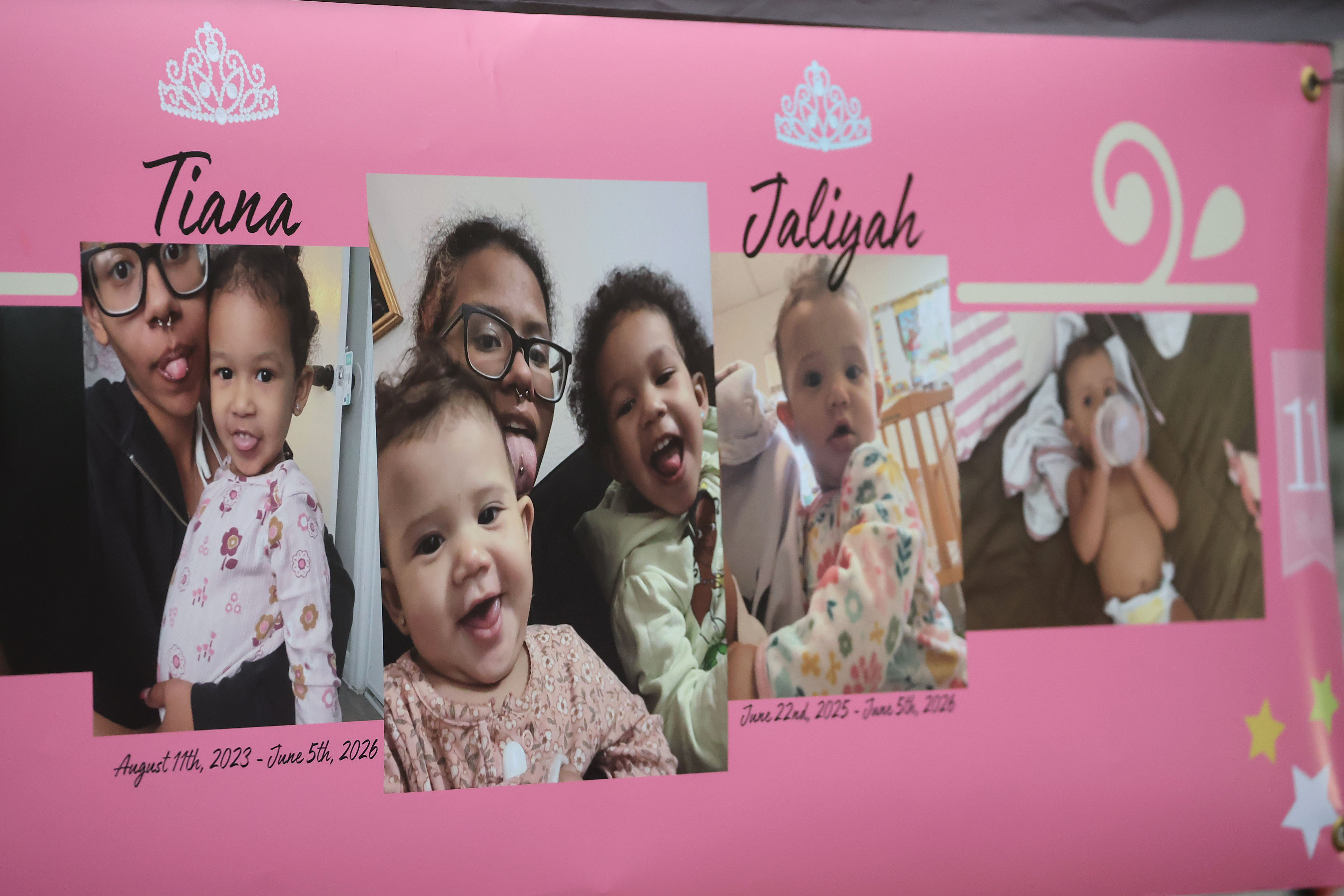 A poster is displayed during a community vigil for 2-year-old...