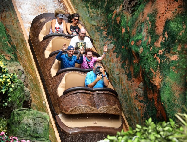 Guests enjoy the big plunge down the front of Tiana's Bayou Adventure at the Magic Kingdom in Walt Disney World. (Joe Burbank/Orlando Sentinel)