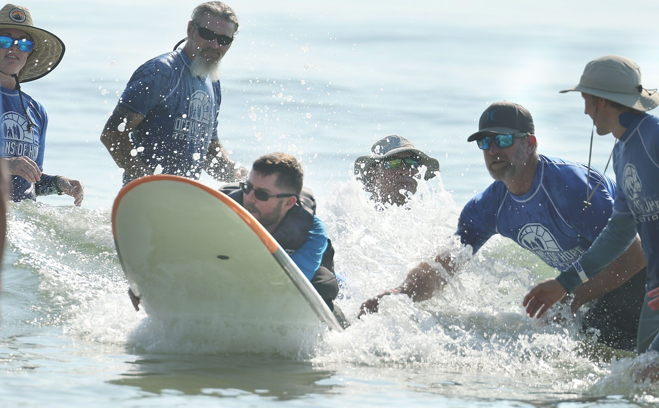 Army veteran Richard Ottum rides a rough wave at New...