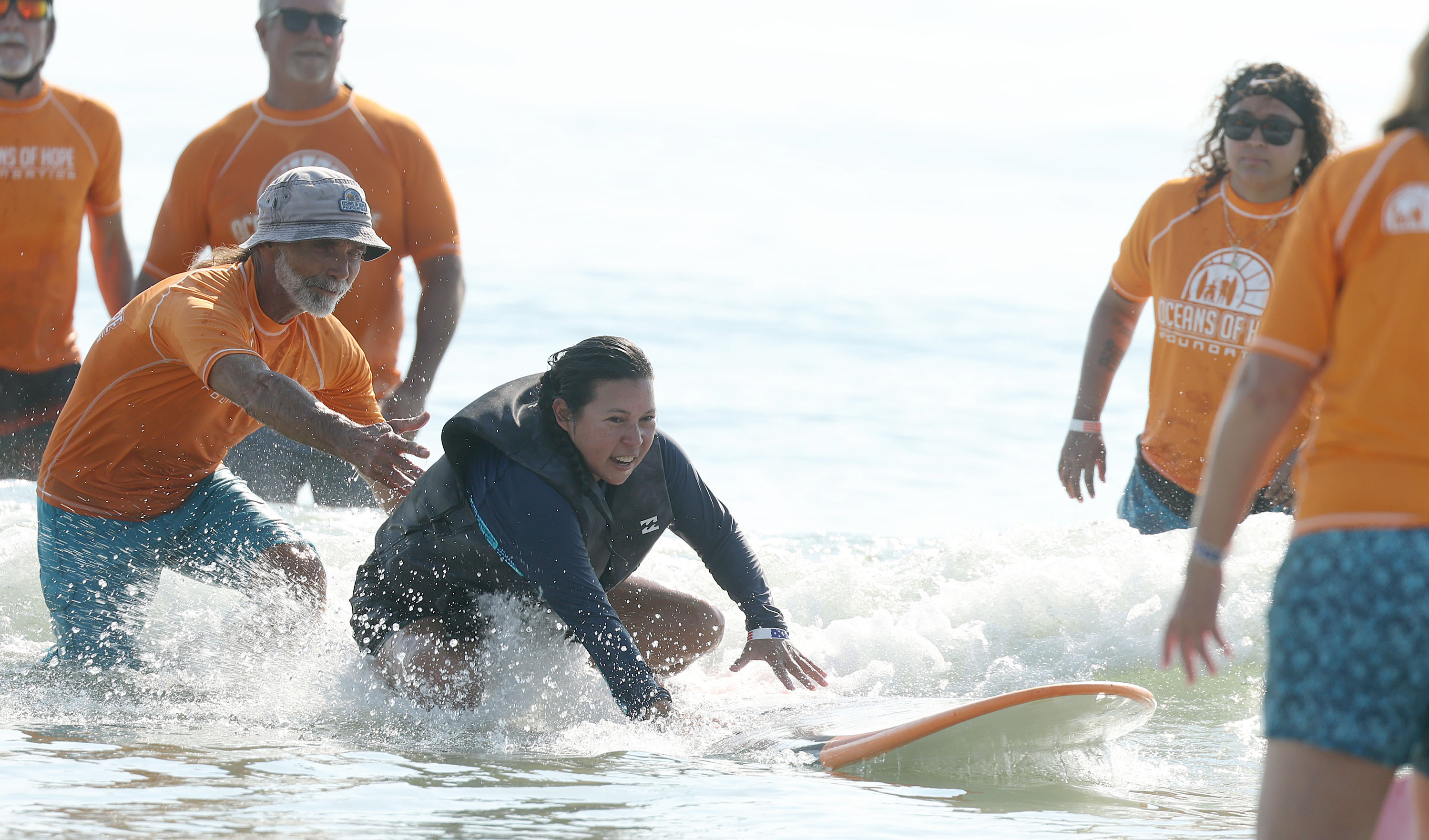 A wounded veteran enjoys the surf at New Smyrna Beach...