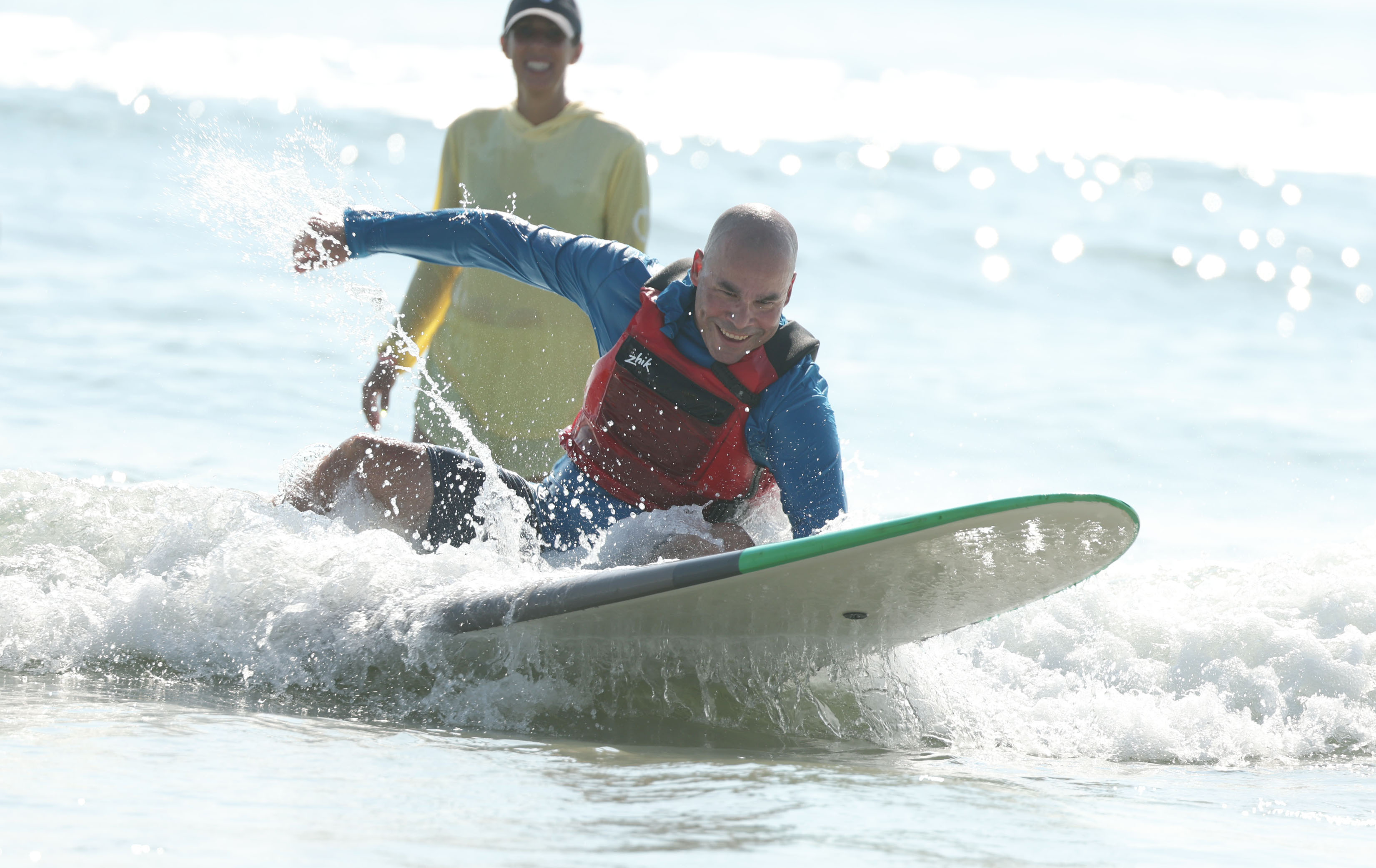 A wounded veteran enjoys the surf at New Smyrna Beach...
