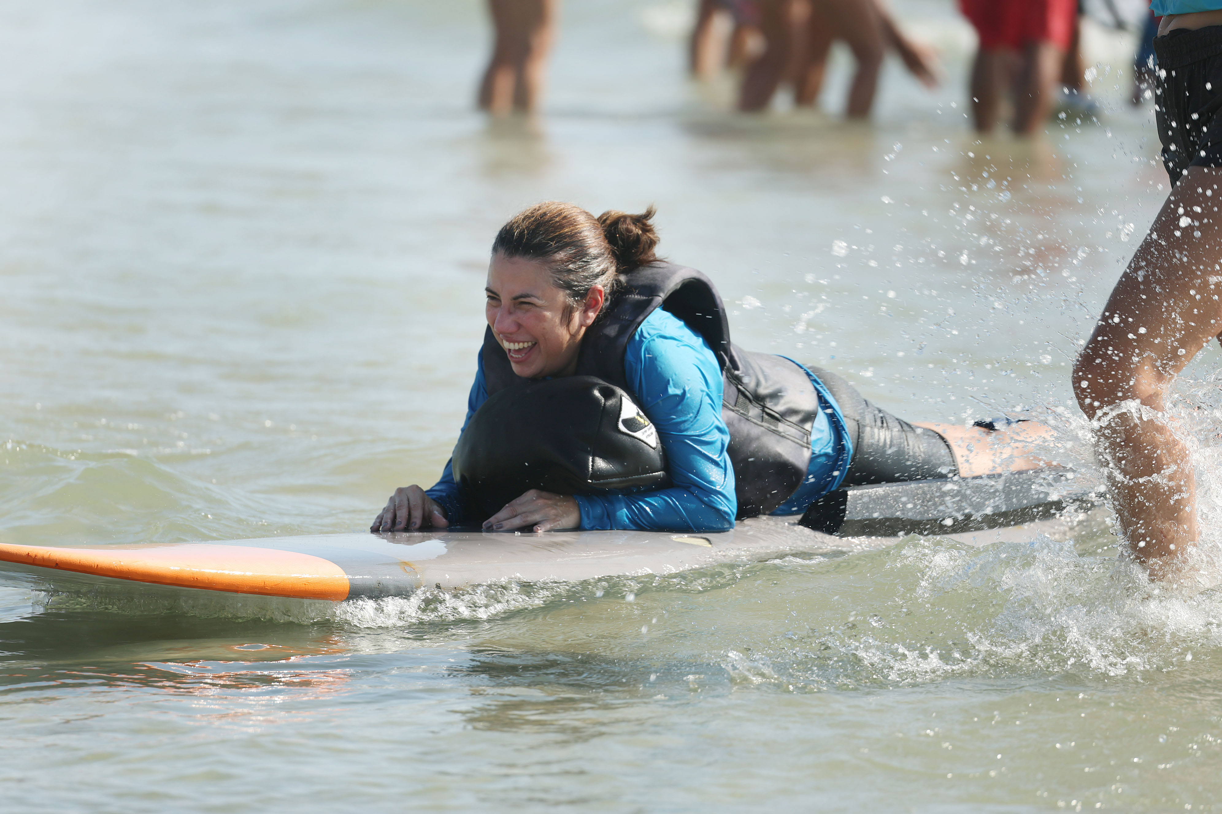 A wounded veteran enjoys the surf at New Smyrna Beach...