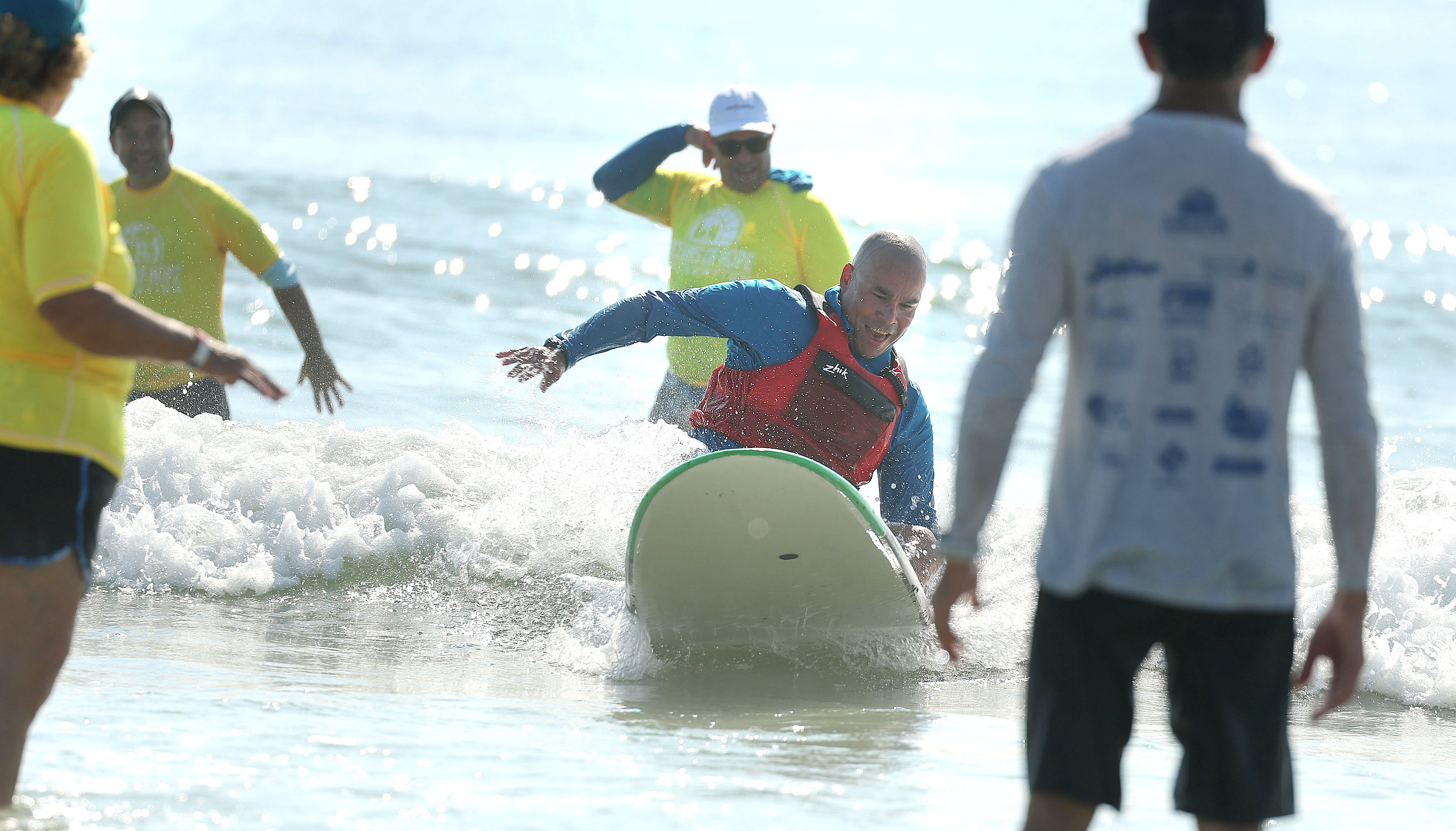A wounded veteran enjoys the surf at New Smyrna Beach...