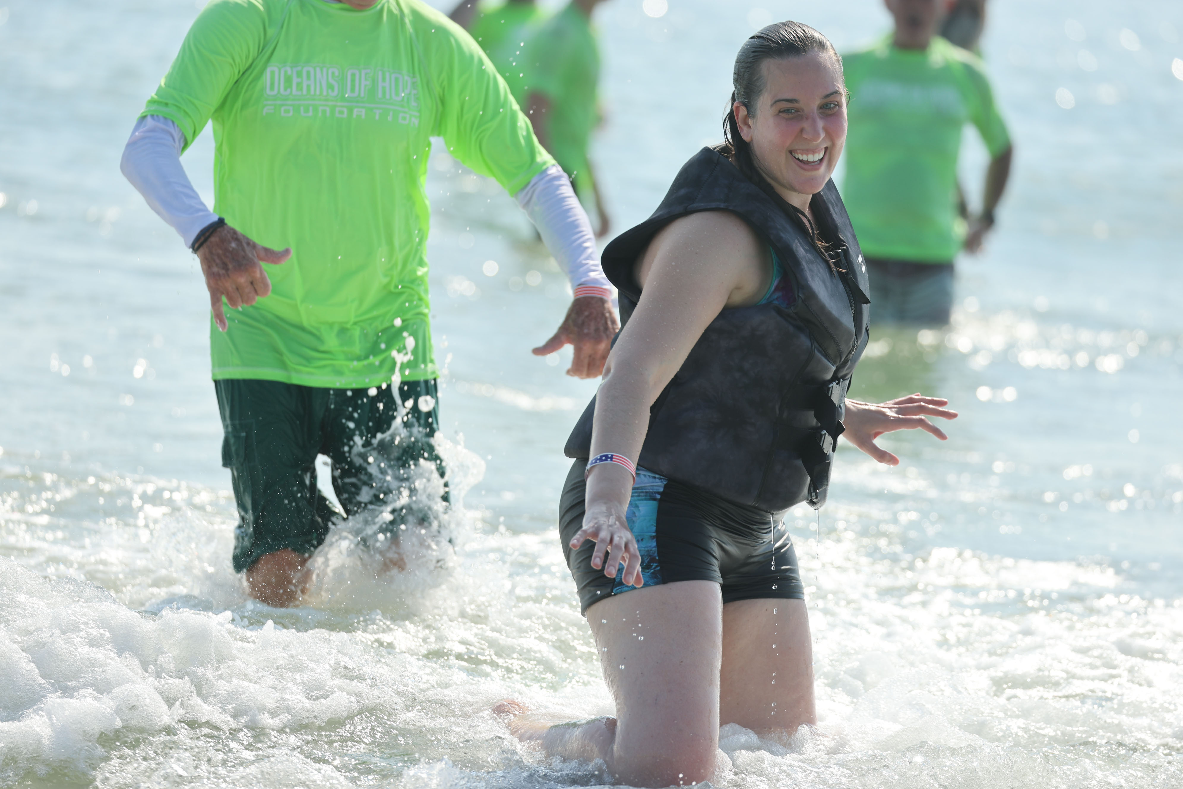 Veteran Virginia White enjoys the surf at New Smyrna Beach...