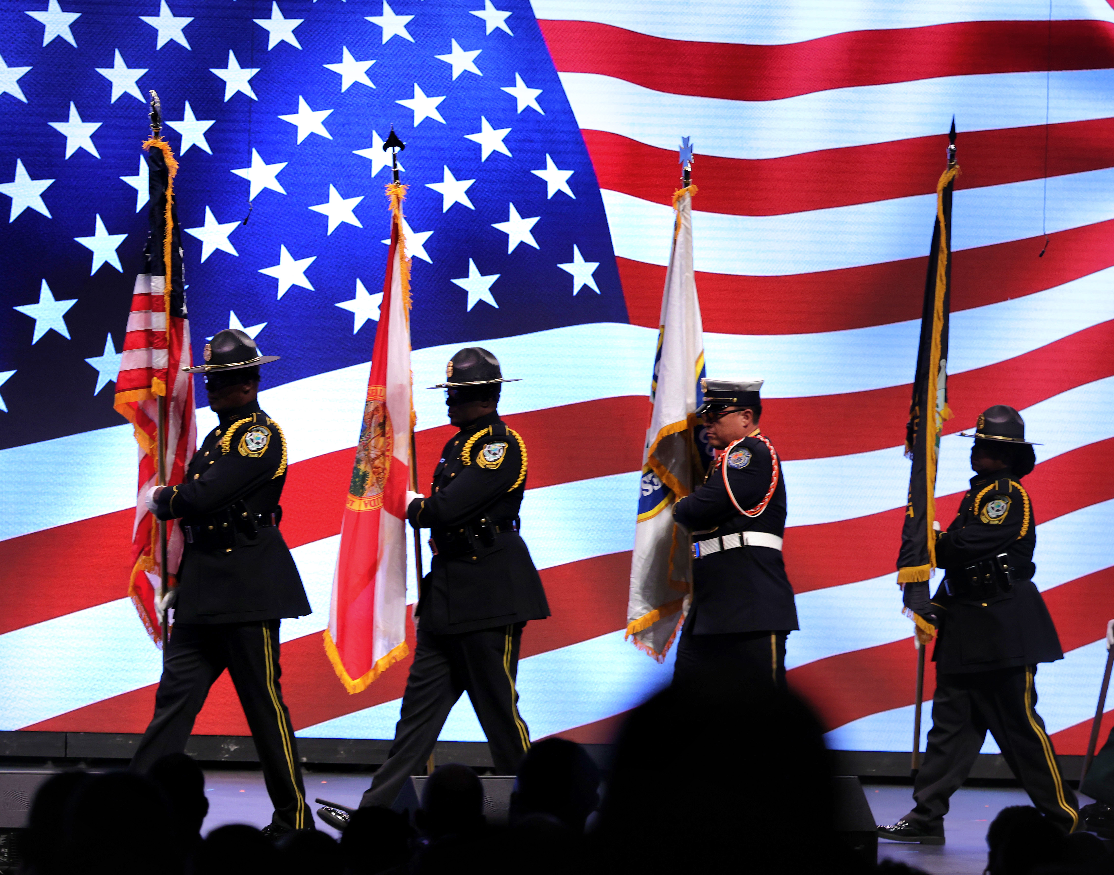 The Orange County Joint Honor Guard guard presents the colors...