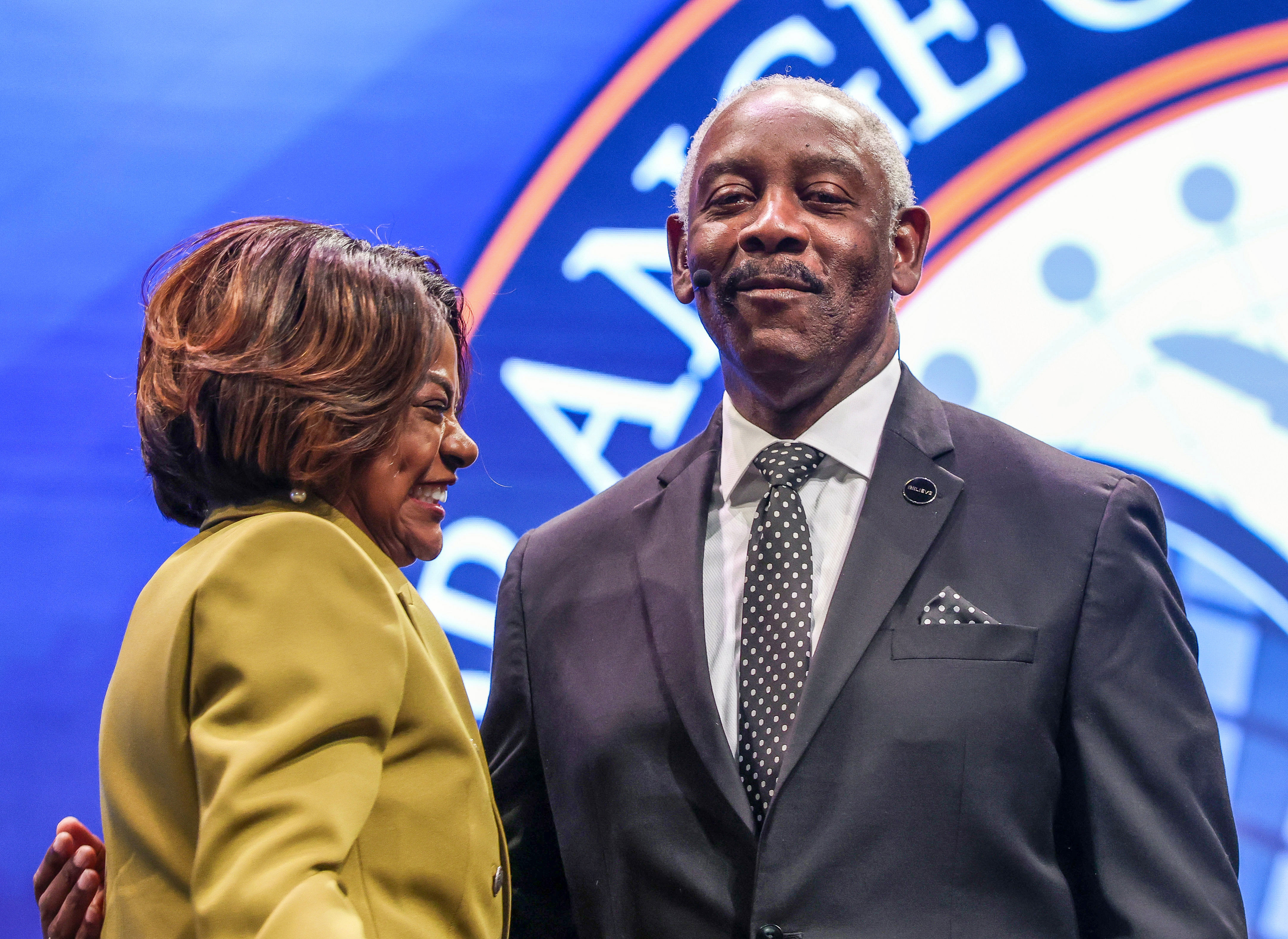 Orange County Mayor Jerry Demings gets a hug from Val...
