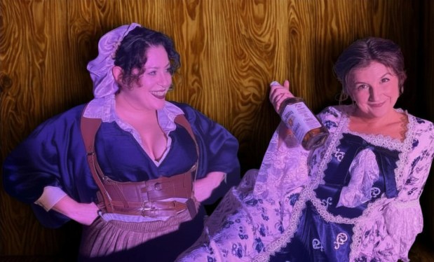 The first lady (Hannah McGinley Lemasters, right) is ready to share a bottle with her friend (Vanessa Sotomayor) in "Dolley. F***ing. Madison." at the Orlando Fringe Festival. (Courtesy New Generation Theatrical)