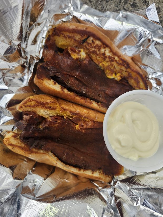 The Juicy Lucy from the Nimbuya food truck comes halved and grill "cauterized," but fear not, you will still get all that oozy cheese when you tuck in. Plus it's easily shareable! (Amy Drew Thompson/Orlando Sentinel)