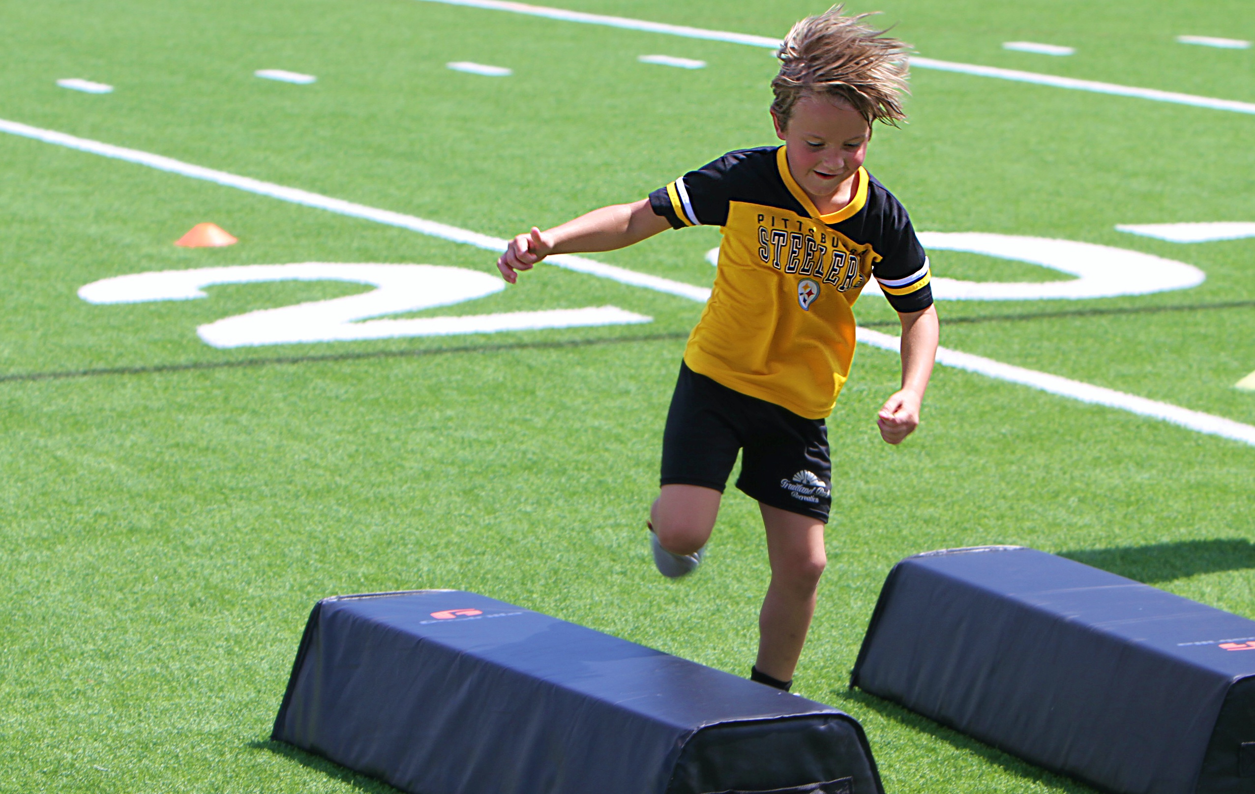 Youngsters go through drills at the 20th Annual Max Starks...