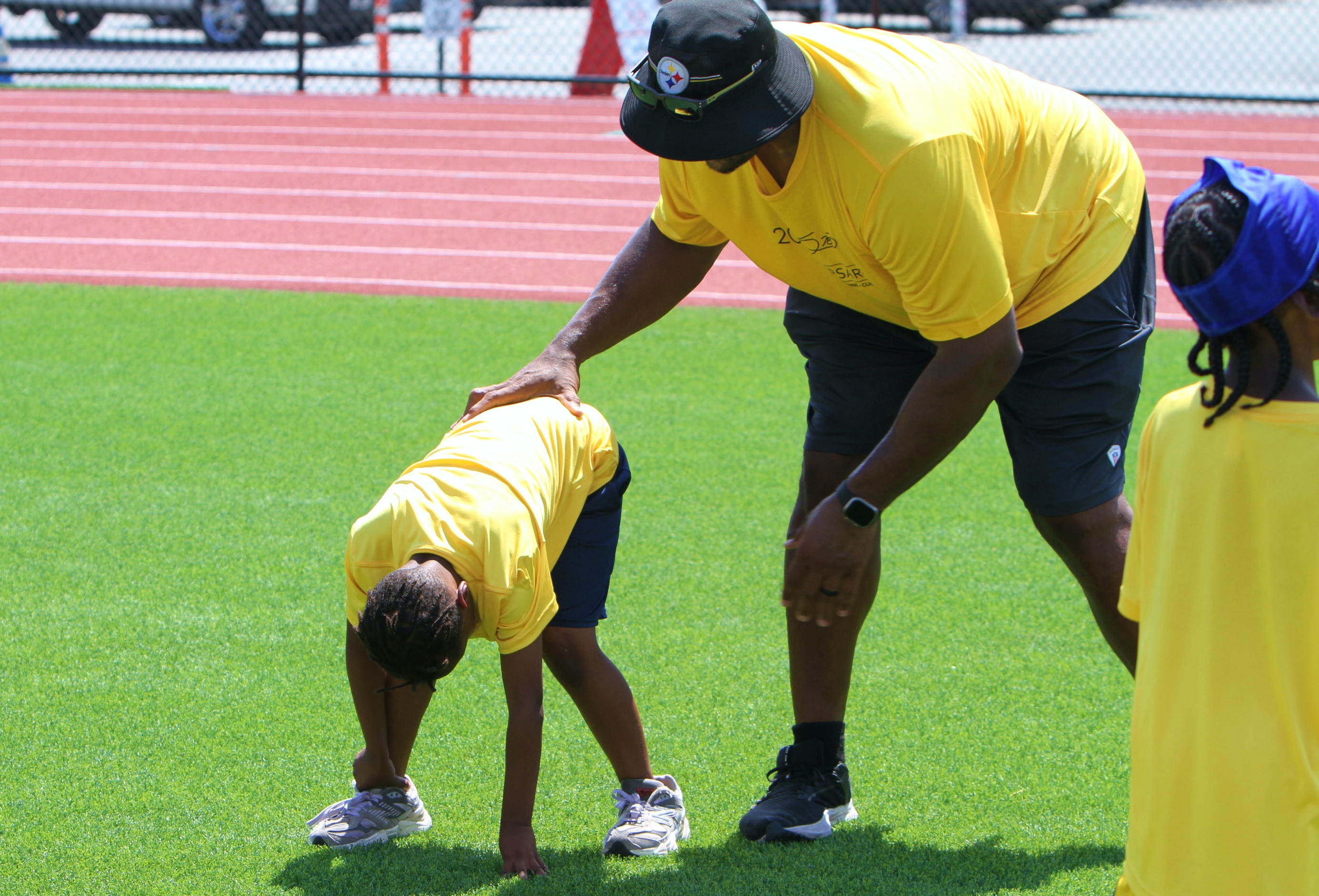 Youngsters go through drills at the 20th Annual Max Starks...