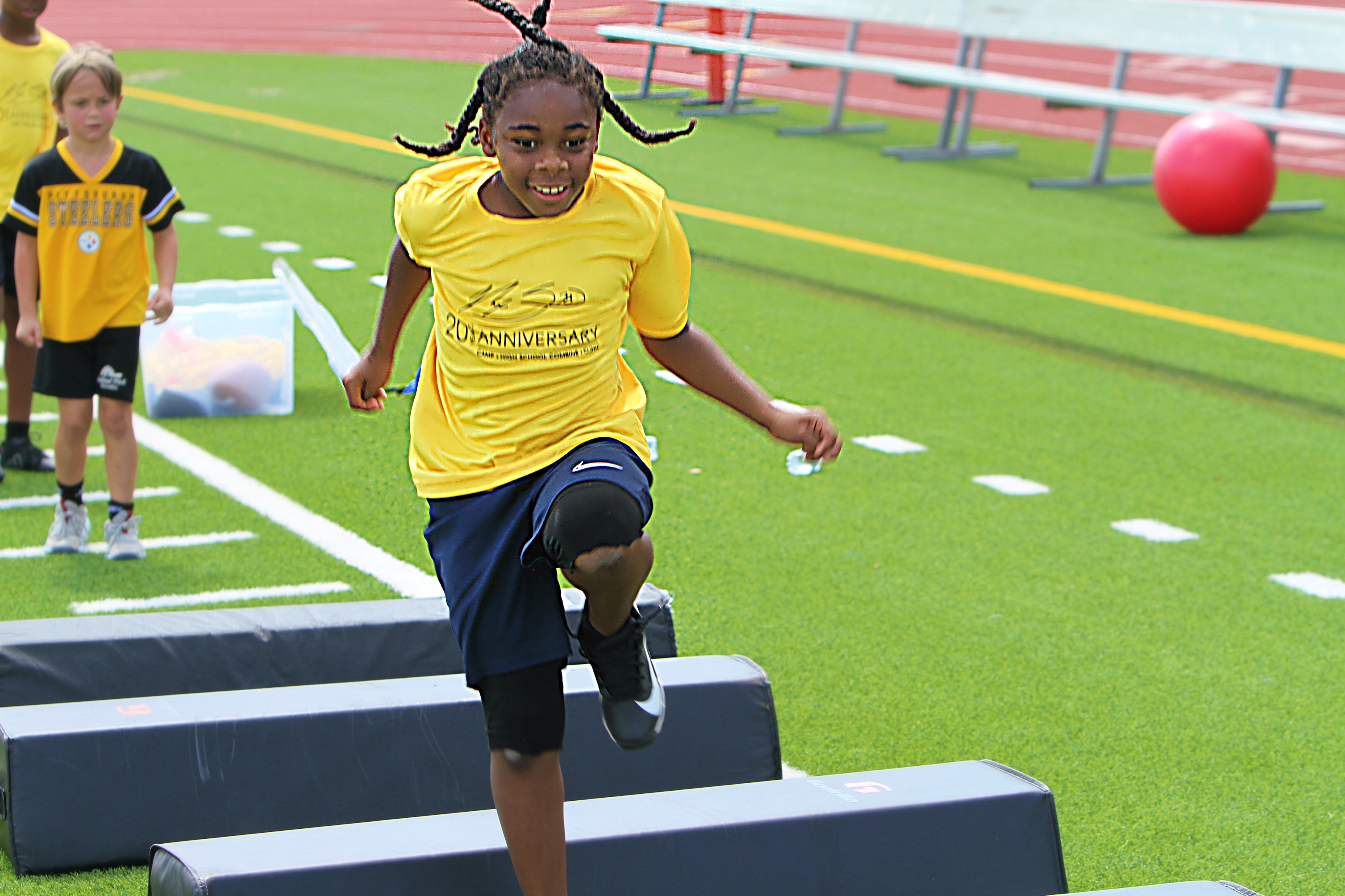 Youngsters go through drills at the 20th Annual Max Starks...