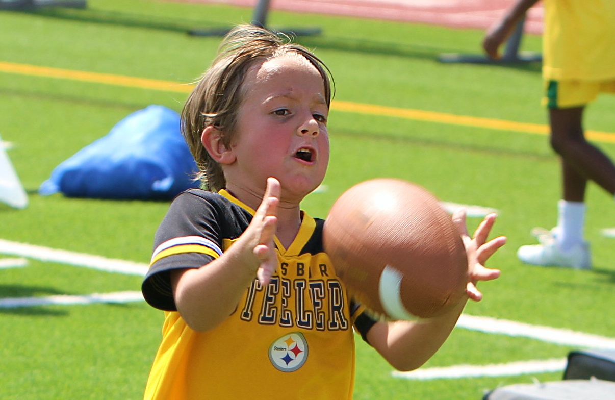 Youngsters go through drills at the 20th Annual Max Starks...