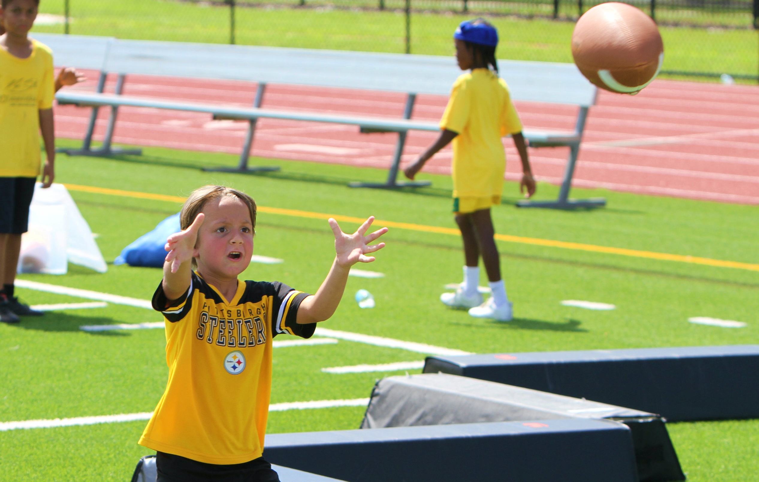 Youngsters go through drills at the 20th Annual Max Starks...