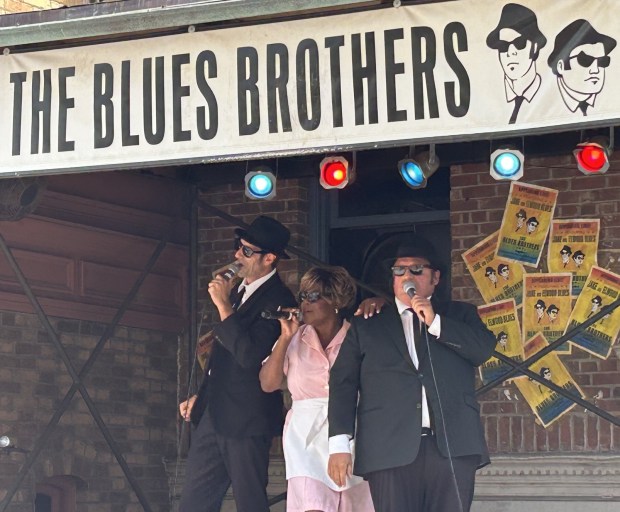 Universal Studios performers sing their way through "The Blue Brothers Show" at an outdoor stage at the theme park. (Dewayne Bevil/Orlando Sentinel)
