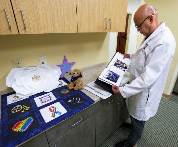 Orange-Osceola Chief Medical Examiner Dr. Joshua Stephany keeps the thank-you postcards and letters for handling the remains of the "49 angels" at his office in Orlando. (Joe Burbank/Orlando Sentinel)