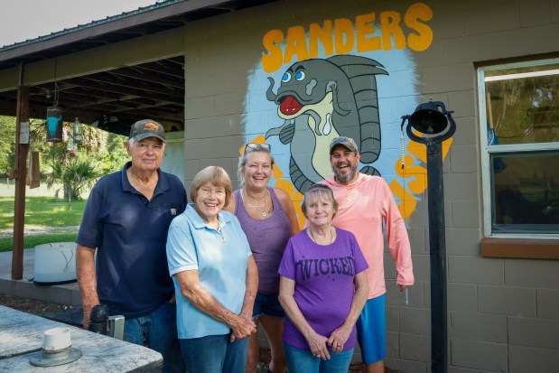 Sanders Fish House owners Richard and Betty Sanders and their daughter, Gerri Sanders (left), with Donna Lazar and Gary Tessero, pause for a portrait before they get back to work. (Rich Pope/Orlando Sentinel)