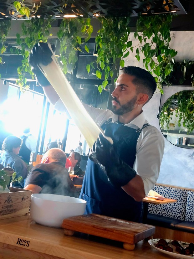 Mozzarella is hand-stretched at the table at one-Michelin-starred Rocca in Tampa. It is served warm with gorgeous tomatoes from nearby Plant City. (Amy Drew Thompson/Orlando Sentinel)