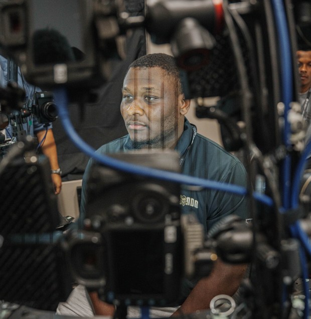 UCF offensive lineman Brad Gurley uses EA Sports' facial scanning process, which uses a rig of high-resolution cameras to capture dozens of photographs of an athlete's face from multiple angles simultaneously. Those images are then stitched together using specialized software to create highly detailed 3D models of players' heads for EA Sports games. (Photos courtesy of EA Sports and UCF Athletics)