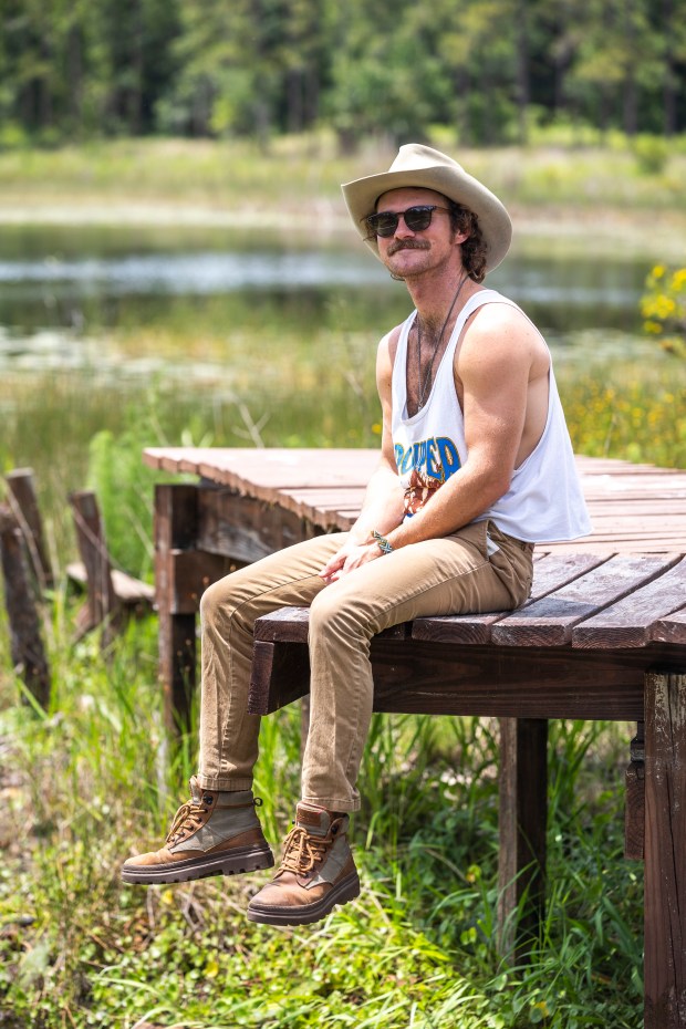 Blair Carlyle is a 30-year-old Florida native who plays the role of Uncle Pappy in inspirational social media videos, seen at his Central Florida cabin on May 29, 2026. (Patrick Connolly/Orlando Sentinel)