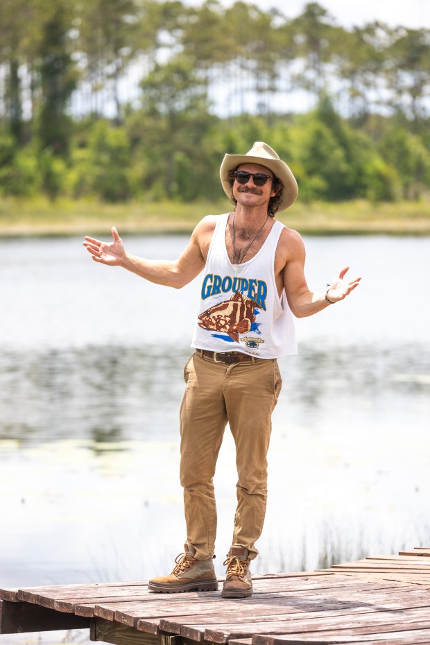 Blair Carlyle is a 30-year-old Florida native who plays the role of Uncle Pappy in inspirational social media videos, seen at his Central Florida cabin on May 29, 2026. (Patrick Connolly/Orlando Sentinel)