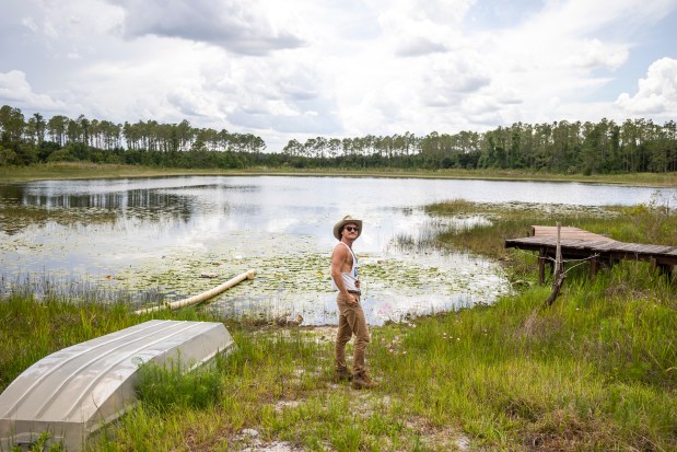 Blair Carlyle is a 30-year-old Florida native who plays the role of Uncle Pappy in inspirational social media videos, seen at his Central Florida cabin on May 29, 2026. (Patrick Connolly/Orlando Sentinel)