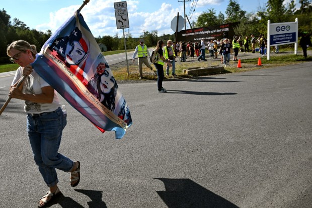 A small group of protest organizers and faith leaders hold a prayer vigil in August 2025 on U.S. Highway 322 near the Moshannon Valley Processing Center.