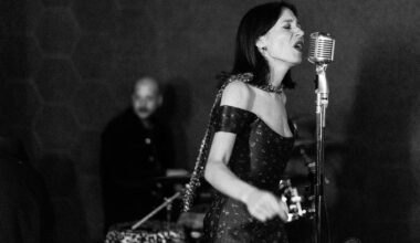 Photo of a jazz singer performing wearing a dress at the Burrow in Miami.