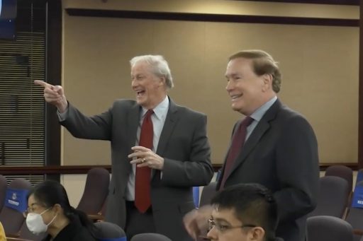 John Thrasher points while standing next to Dean Blomberg.